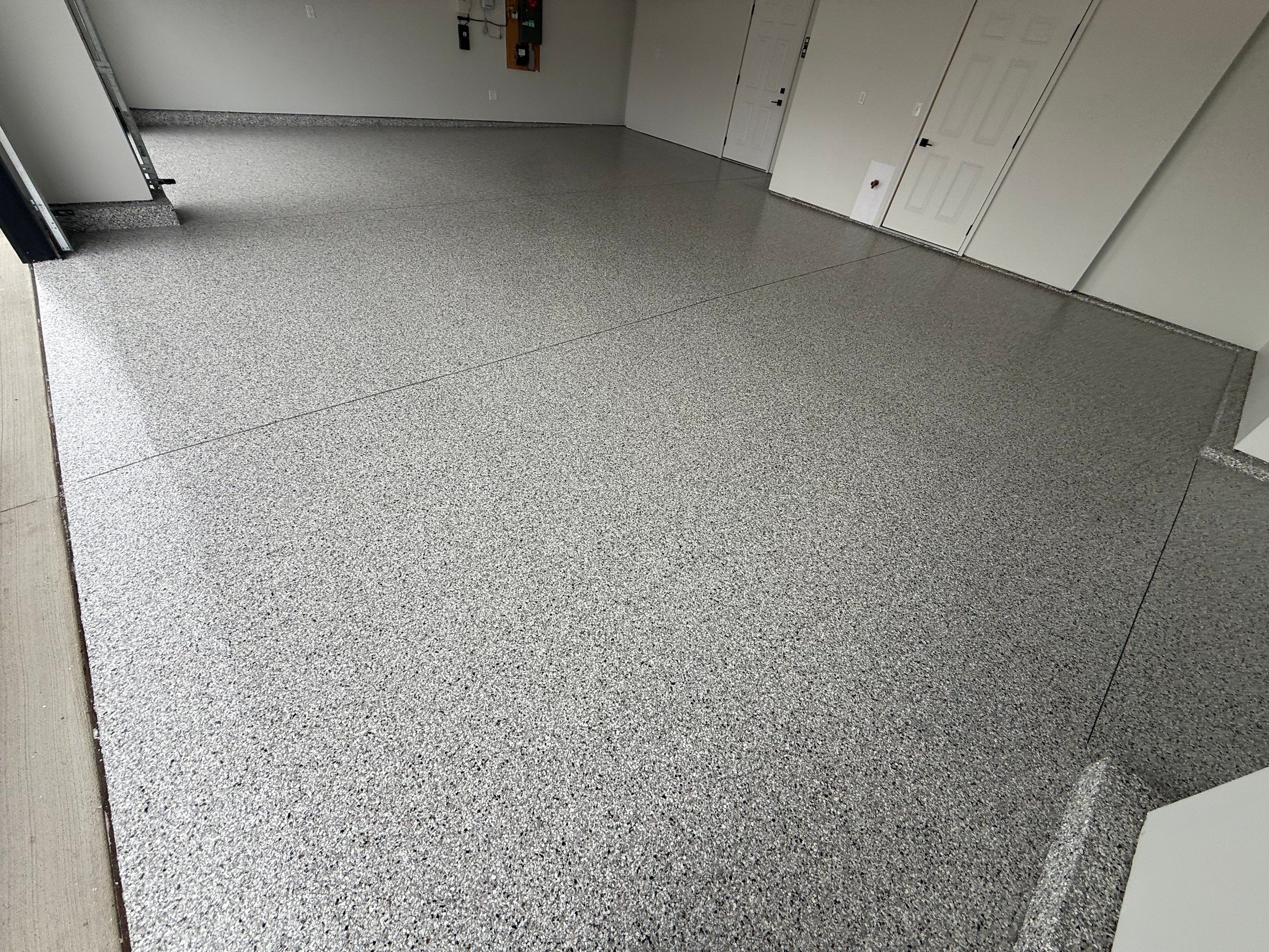 High-Gloss Epoxy Flake Garage Floor Coating in Brandon by Select Painting, Coatings & Garage Cabinets