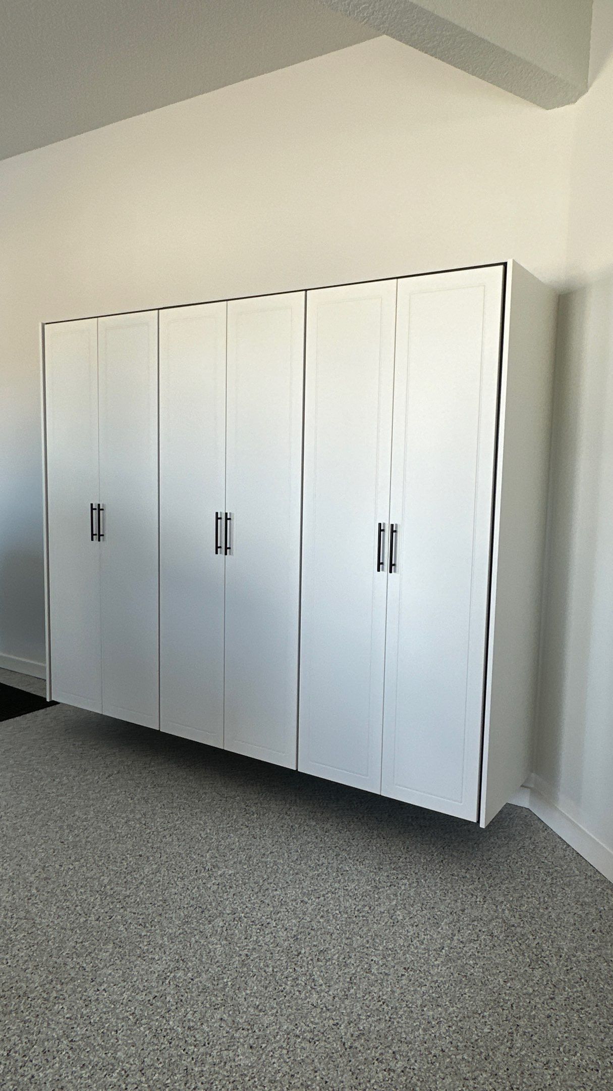 Jon S. transformed his garage with a new floor, slotwall & Cabinets! by Banner Garage