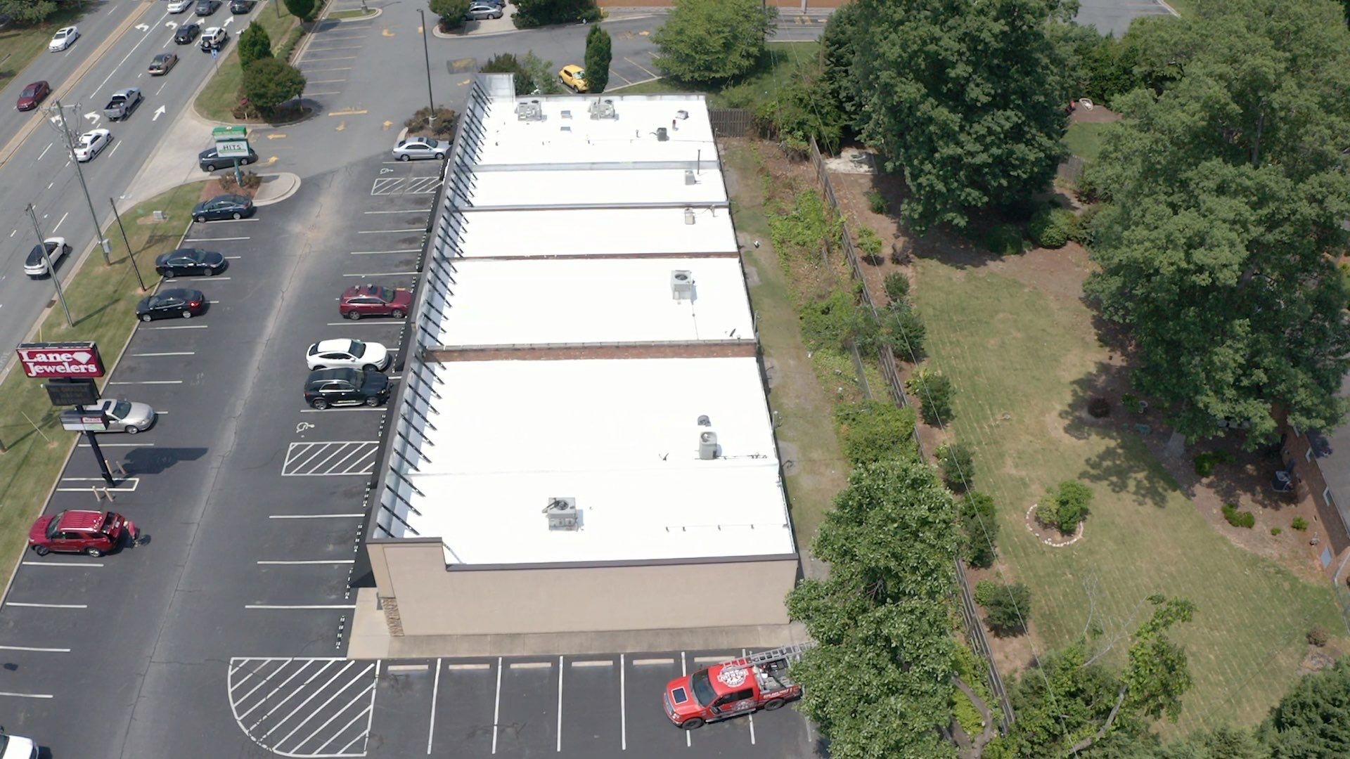 Commercial Roof Coating using Fiberseal basecoat and Silicon Topcoat by Just In Time Roofing and Restoration