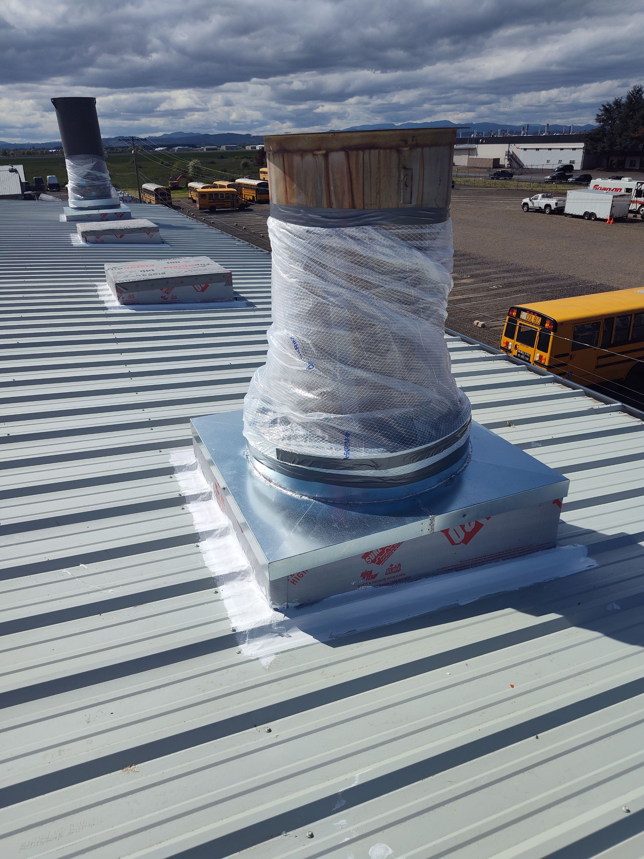 Installing New Curbs on a Metal Roof for new equipment by BEST Roofing & Waterproofing