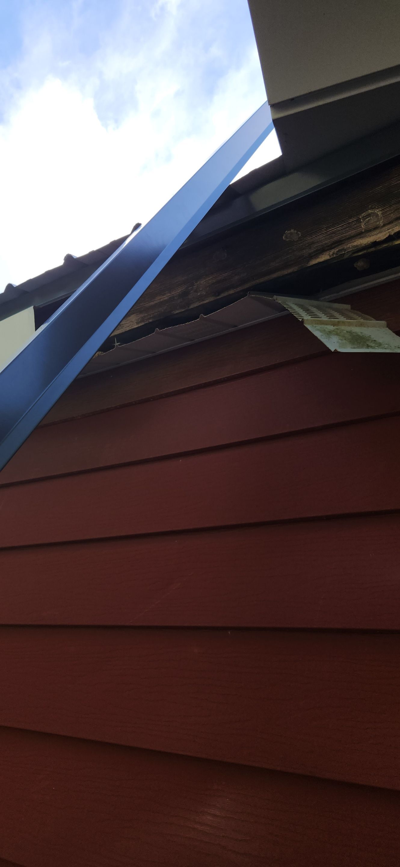 Residential Roofing Installation using 26 Gauge Colored Panels by Hostetler Roofing