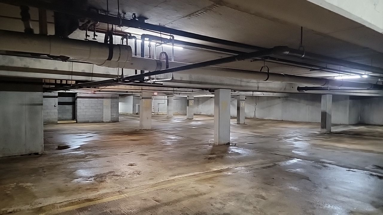 Parking garage using Hot water by Northern Power Washing LLC.