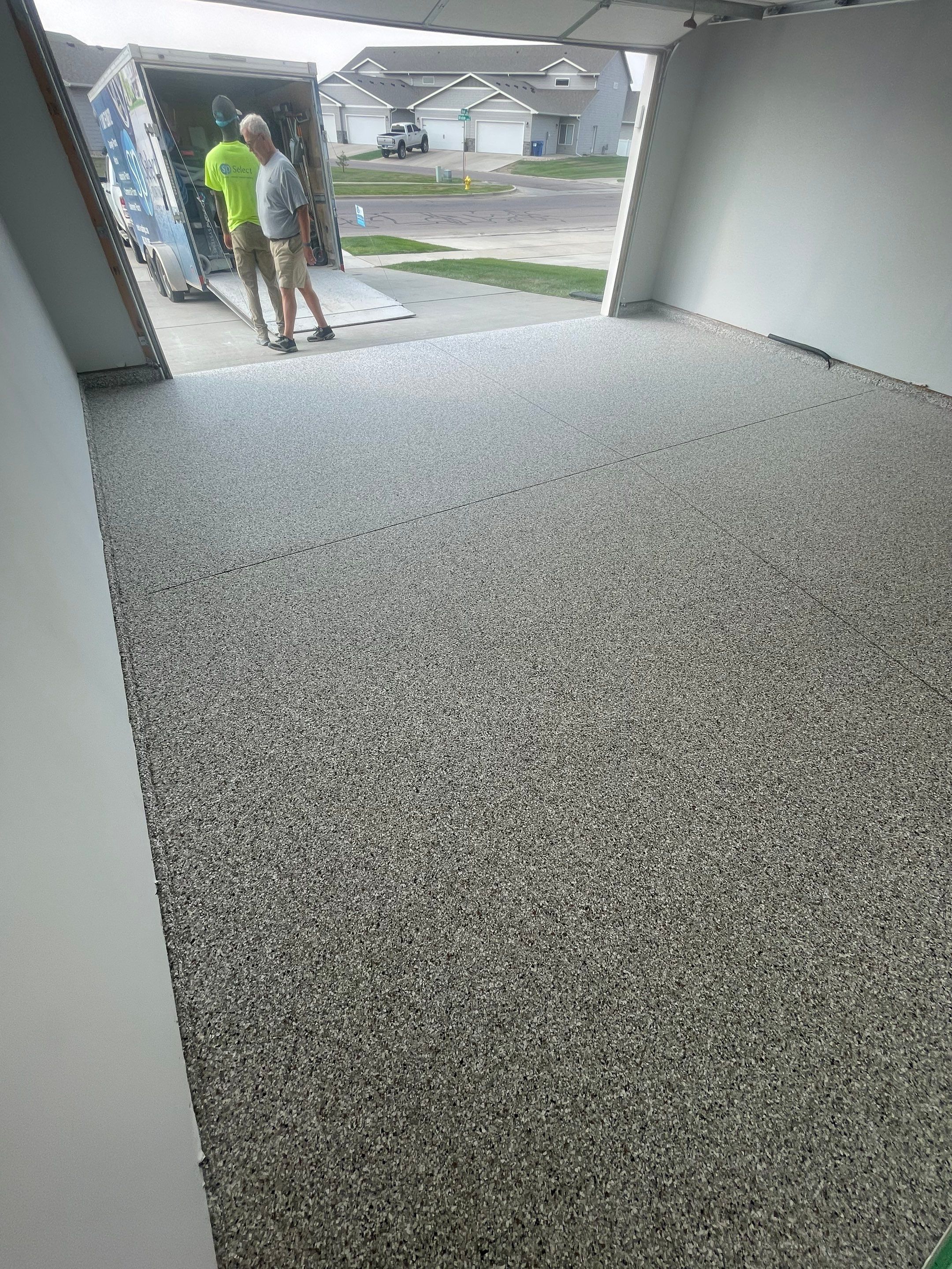 Custom Coyote Flake Garage Floor Coating in Sioux Falls by Select Painting, Coatings & Garage Cabinets
