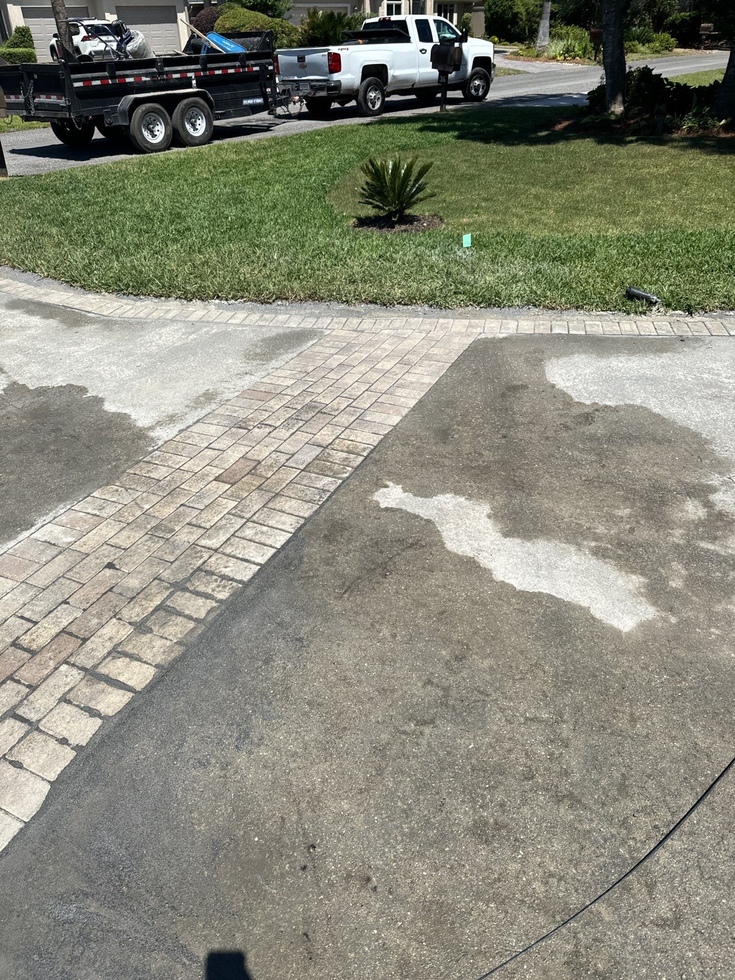 Concrete Driveway Repair with Decorative Paver Accents in Hilton Head Island by Lowcountry Scapes, LLC