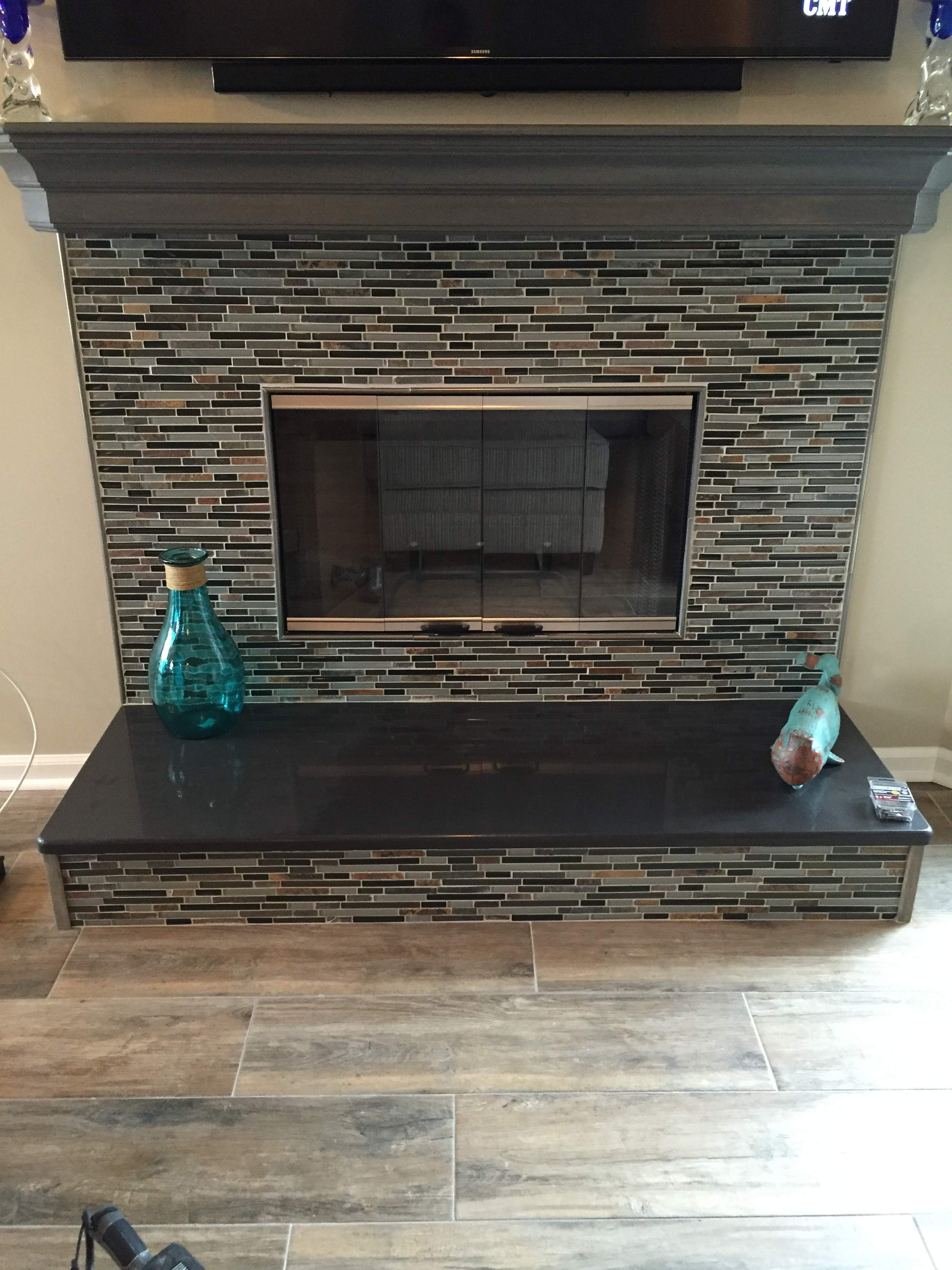 Wood Fireplace + tile + mantel by Premier Chimney and Roofing