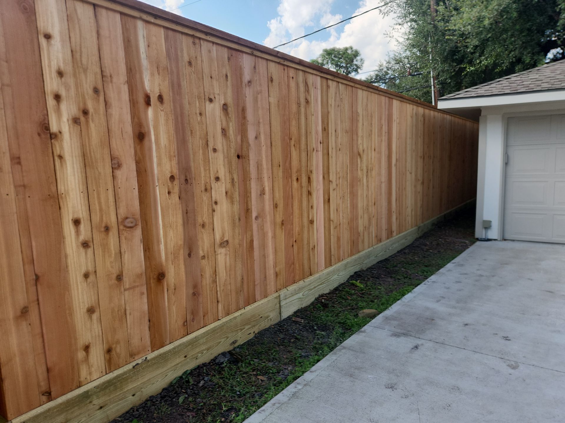 8ft Tall wood fence installation by Tim's Fences