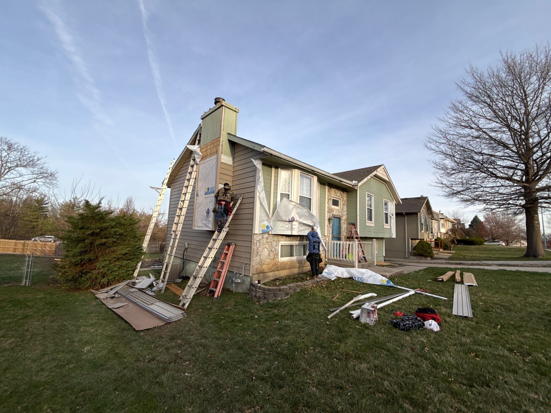 Kansas City Horizontal Vinyl Siding Installation for Split-Level Residence by EEC Windows, Siding & Roofing