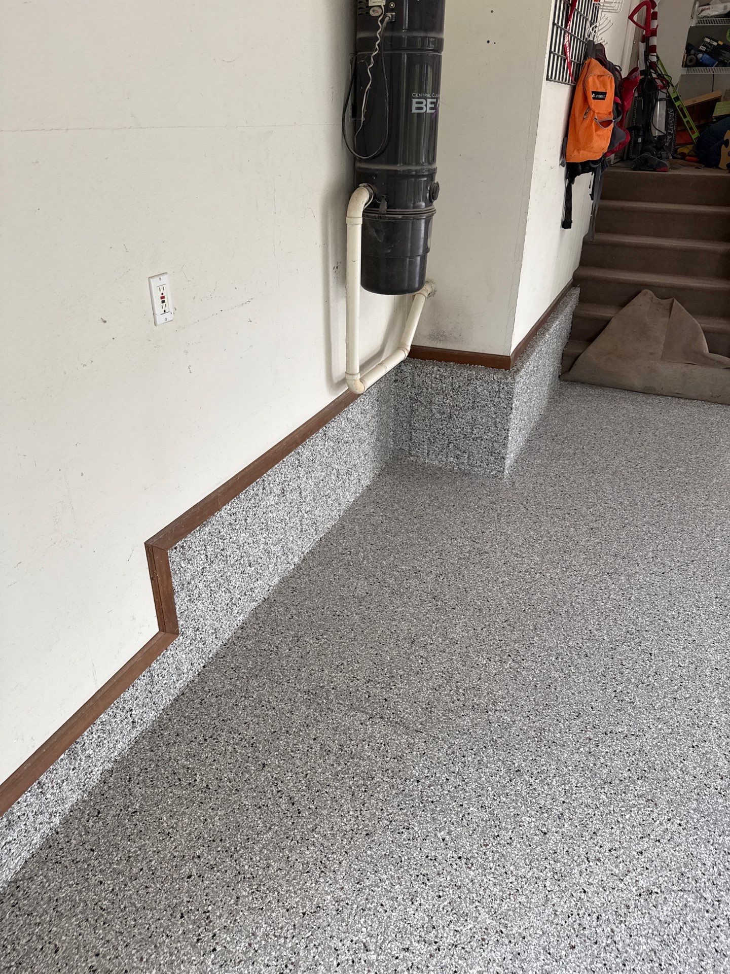 Coyote Flake Epoxy Garage Floor Coating in Earlham by Revival Concrete Coatings