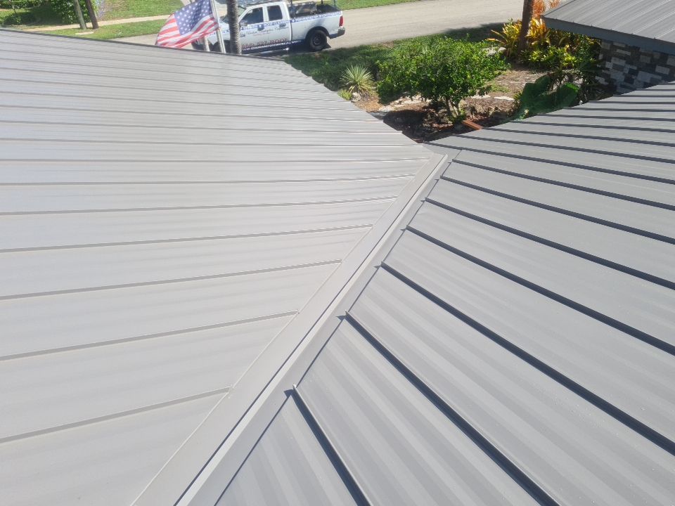 Residential Roofing Installation using 1" Nail strip metal roof by BLUES BROTHERS CONSTRUCTION CORP