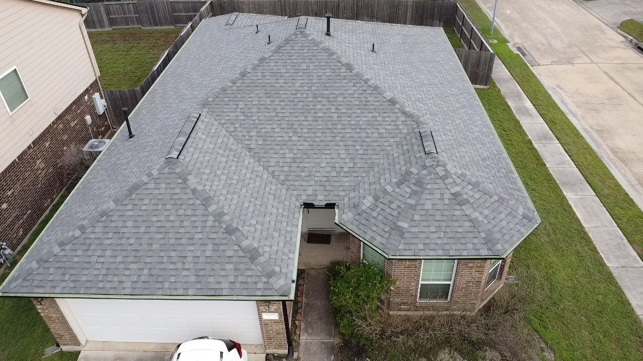 Reroof and Gutter Project in Houston by Roofing Technologies Unlimited