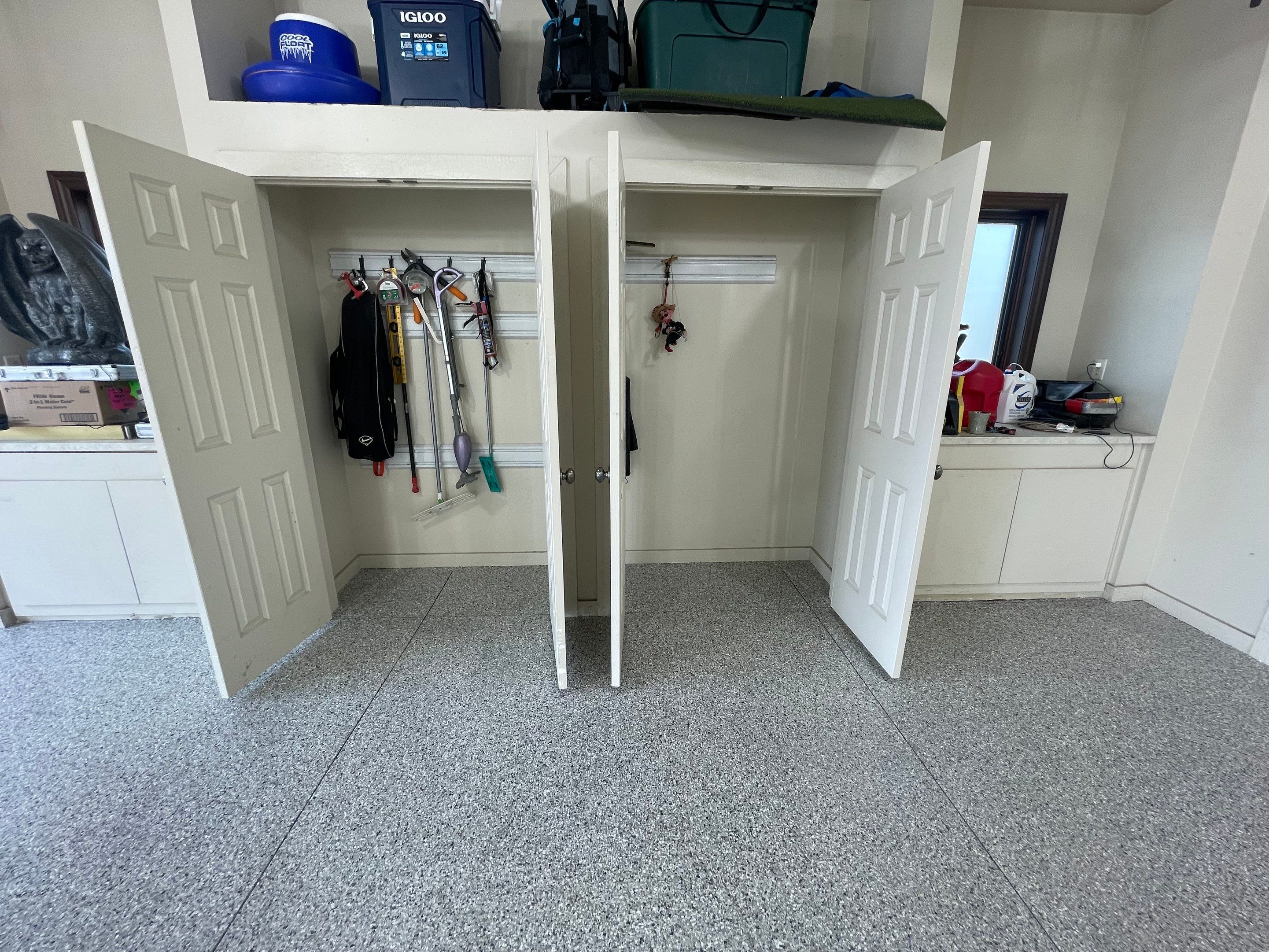 Coyote Flake Garage Floor Coating in Sioux Falls with Trench Drain by Select Painting, Coatings & Garage Cabinets