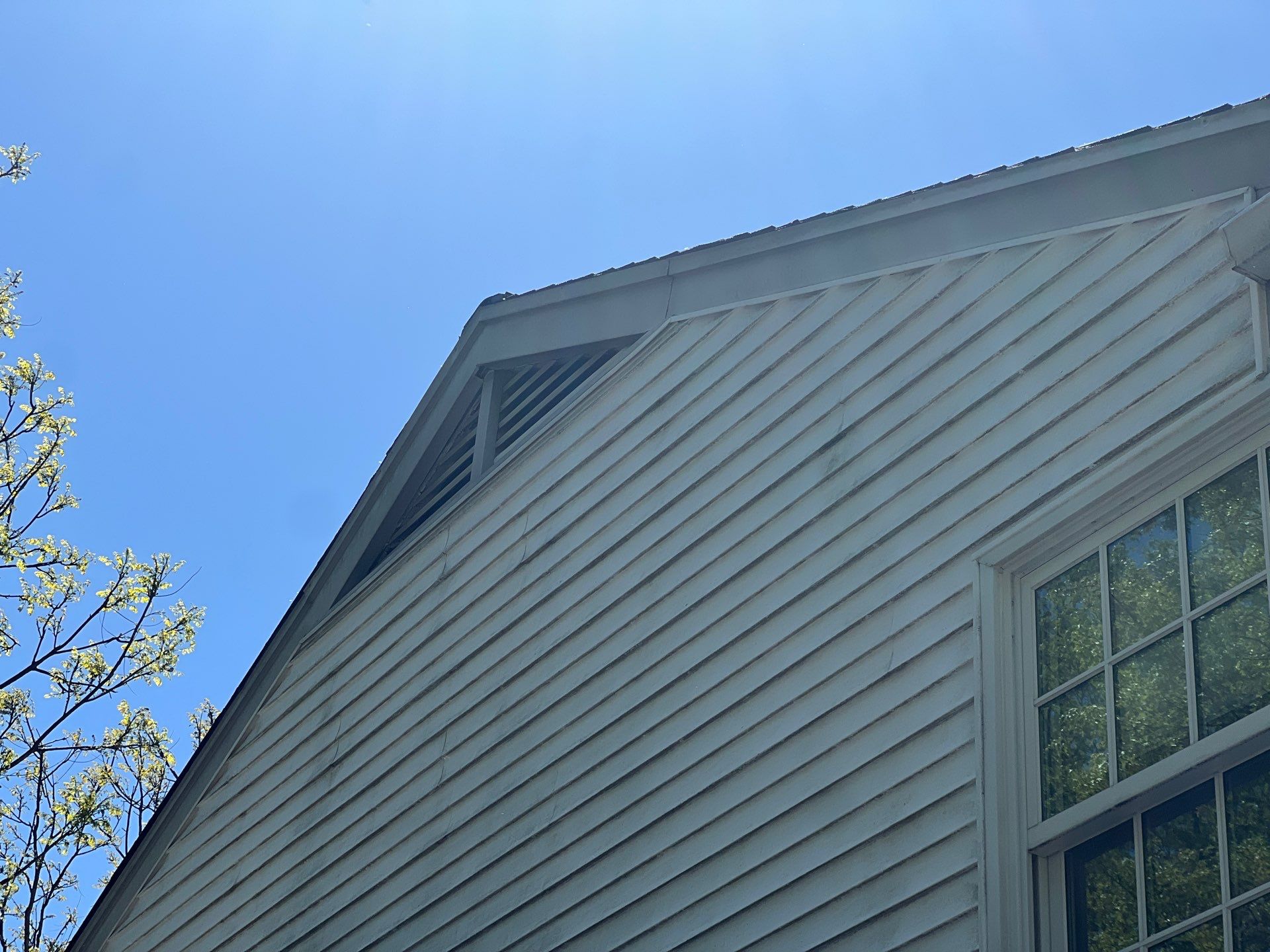 Housewashing  using Algaecide, soft wash soap by Northern Power Washing LLC.