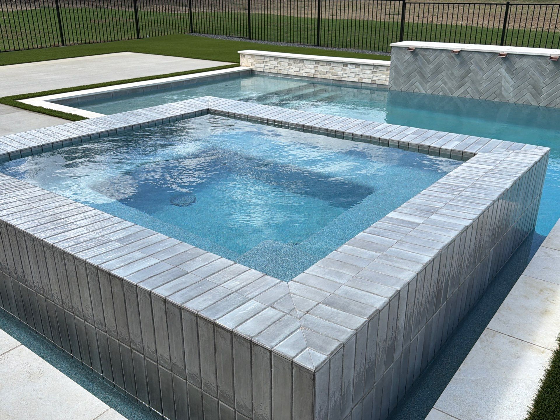 Modern Geometric Pool with Raised Spa and Tanning Ledge by Pinnacle Pools and Spas - DFW