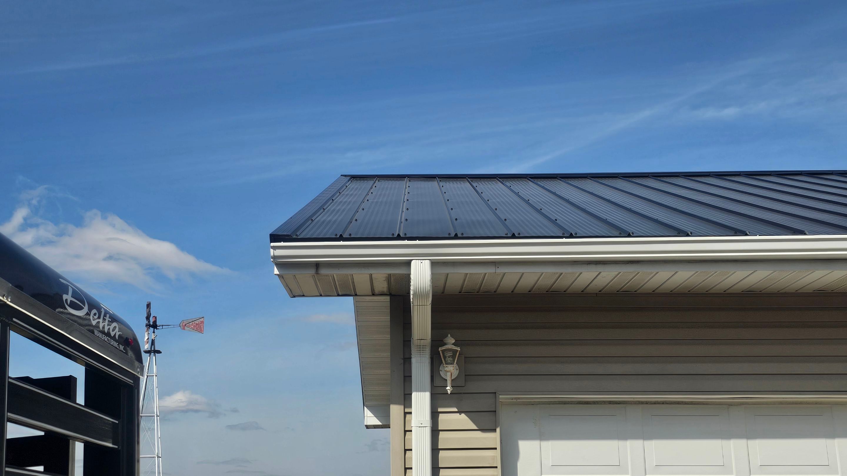 Residential 26 Gauge M-Rib Metal Roof + Gutters, Downspouts & Gutter Covers Install  by Titan Commercial & Residential Roofing 