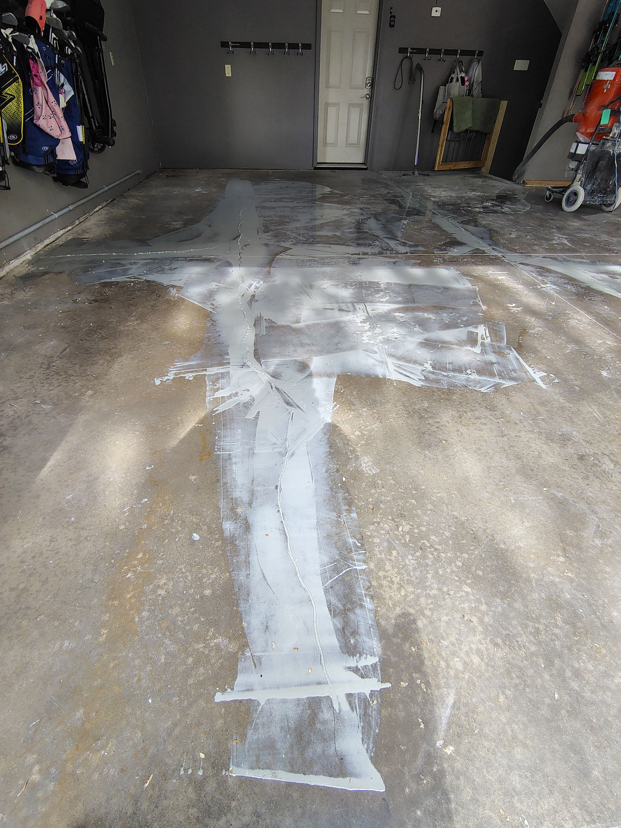 Garage Floor Concrete Coating and Crack Repair in Sioux Falls by Select Painting, Coatings & Garage Cabinets