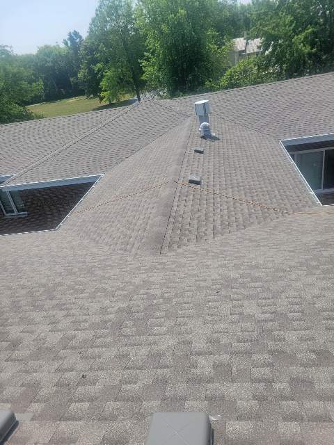 Asphalt Roof Replacement and Aluminum Gutter Installation by Custom Installations
