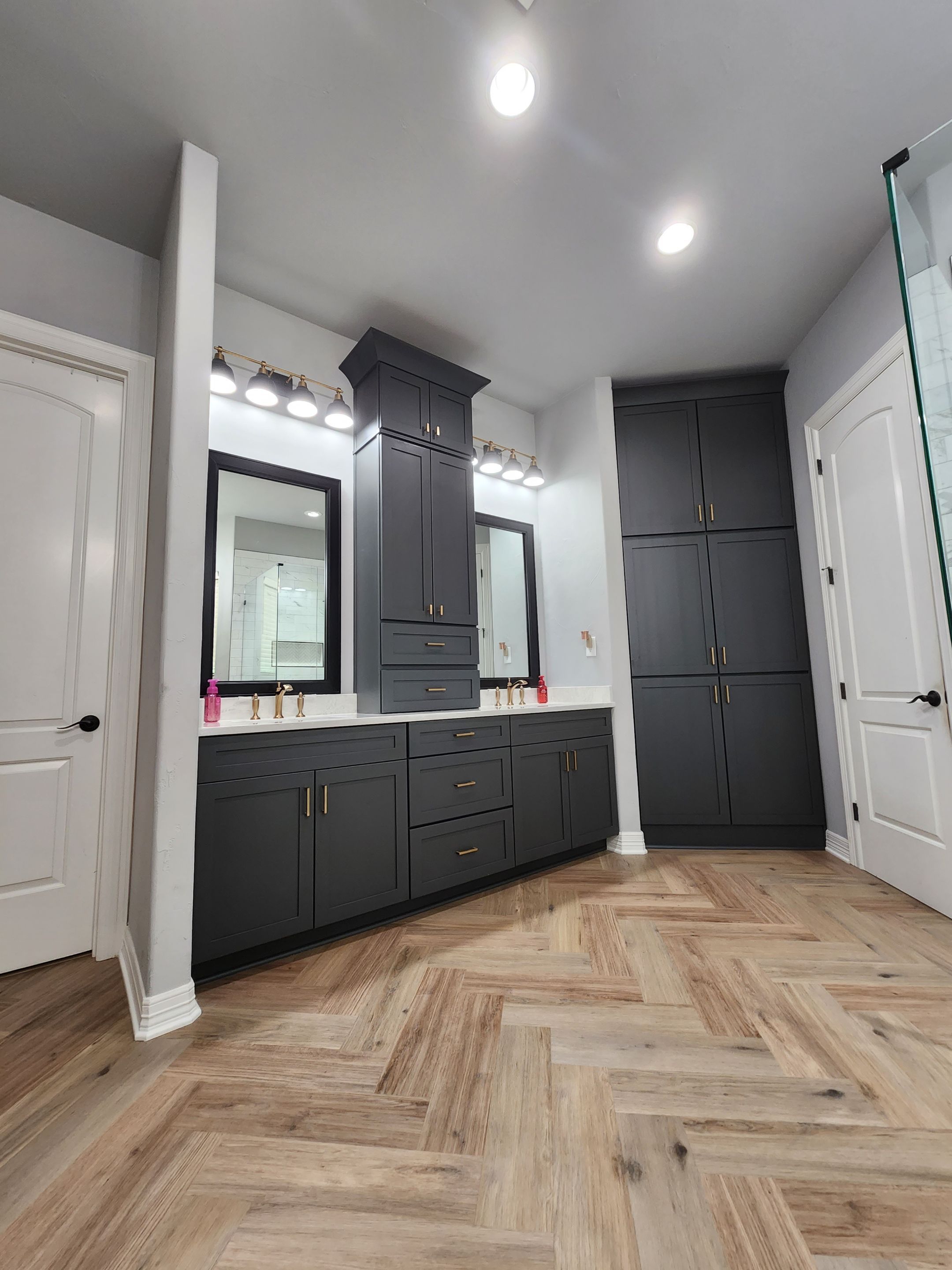 Spring Bathroom Remodel with Black Free-Standing Tub and Walk-In Shower by Legacy Bath and Kitchen