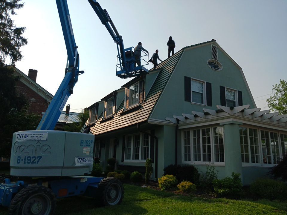 Slate removal/Cedar Shake replacement by Storm Contracting 