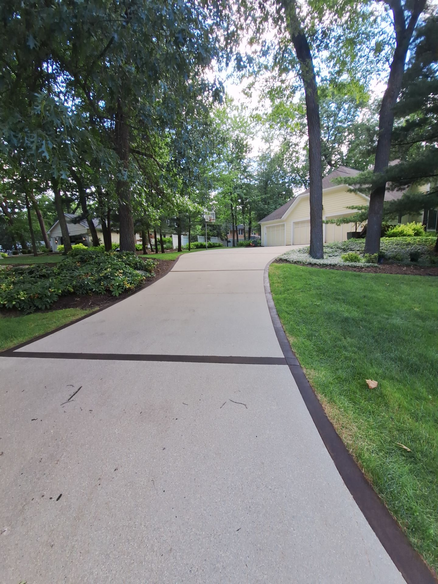 Concrete Driveway and Walkway Staining With Espresso Borders in Grand Rapids by Gordon Painting