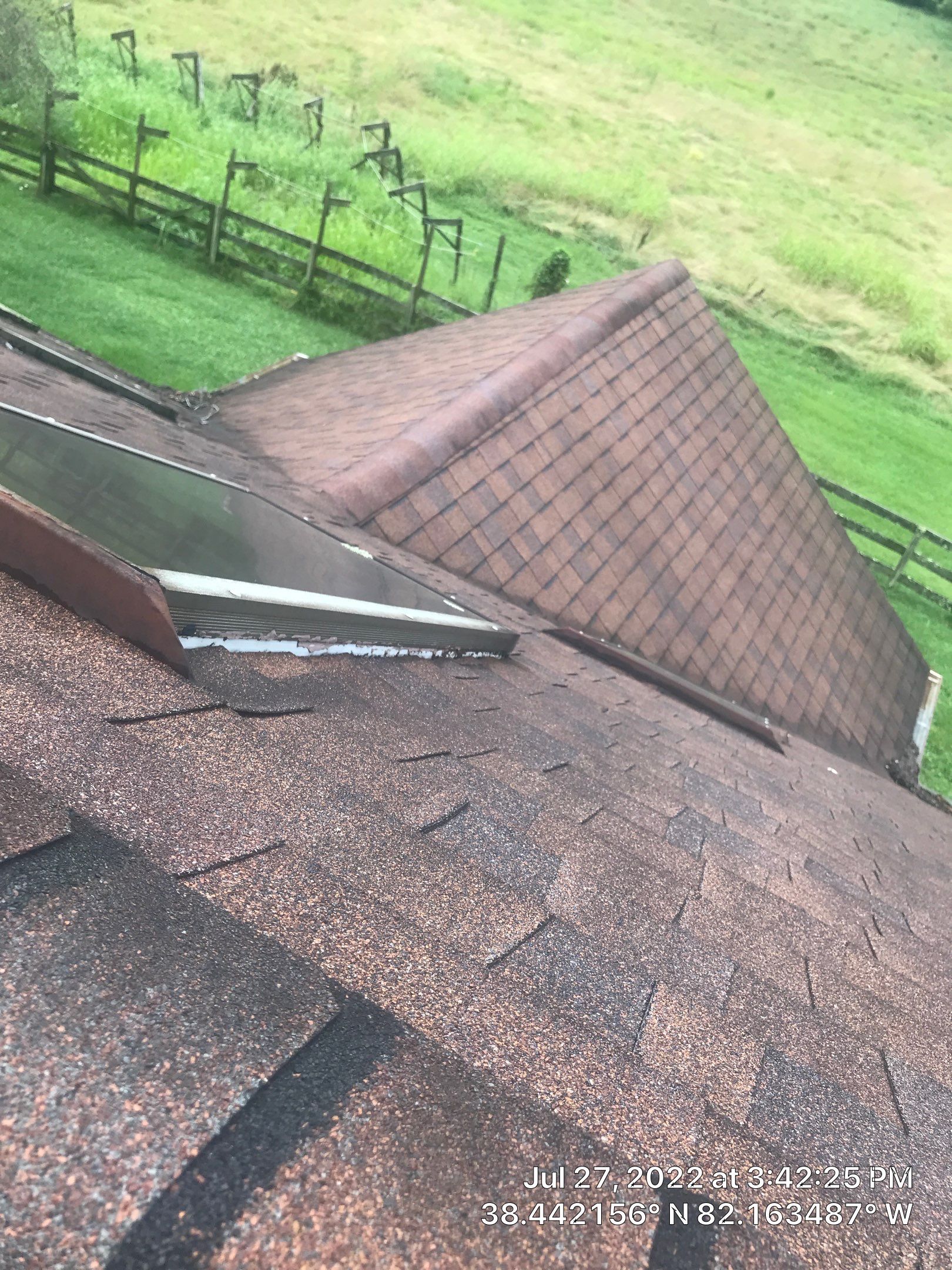 Shingle Roofing with Velux Skylight replacement and stone chimney flashing  by Secure Construction Company Inc