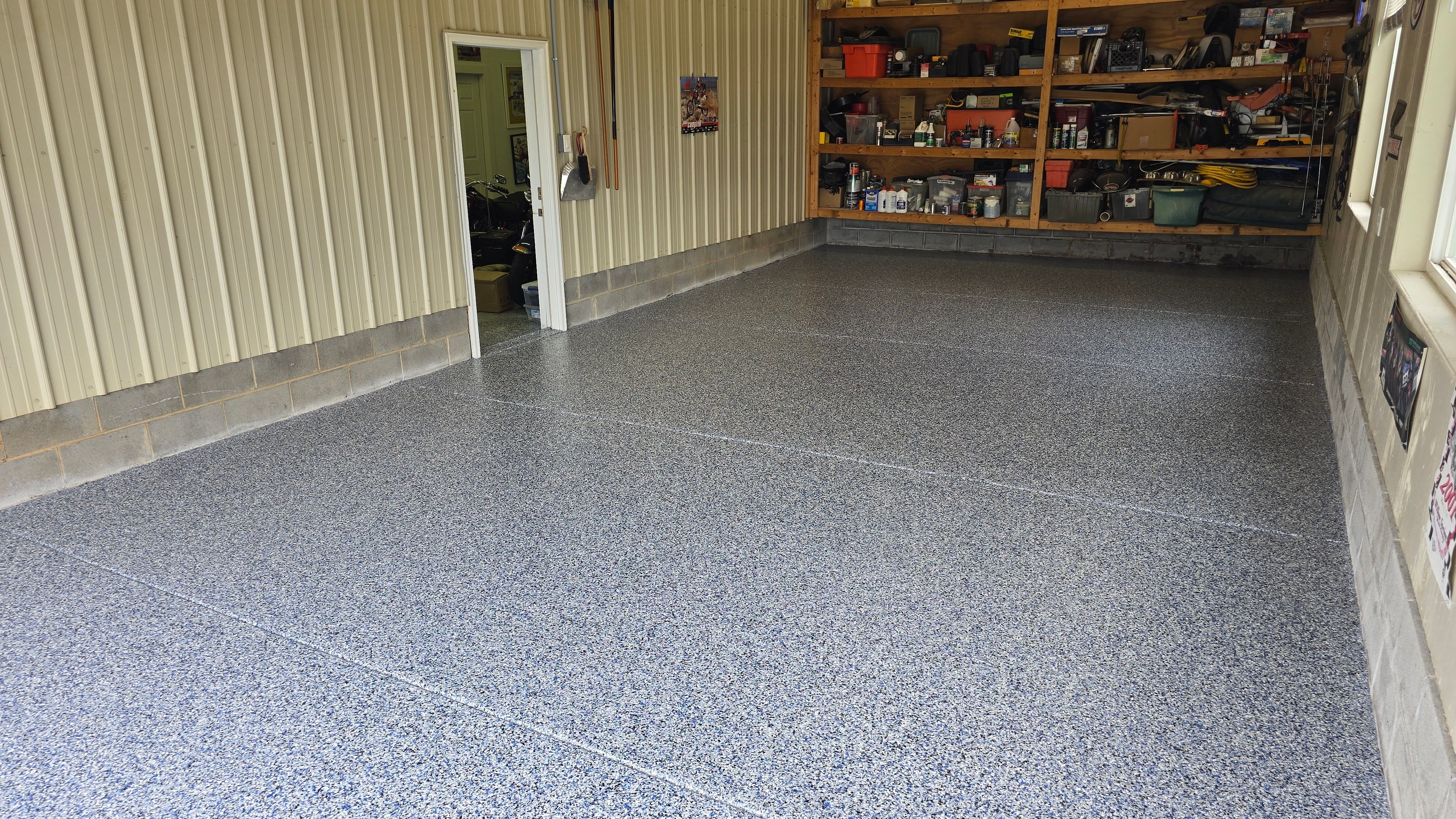 Two garages completed using Shoreline and Midnight by Elite Floor Solutions