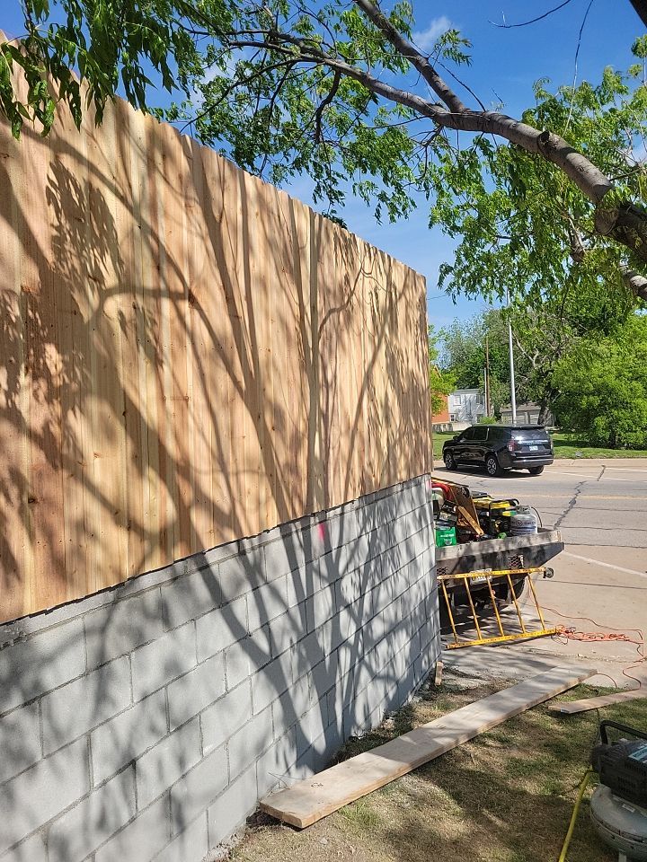 Cedar Fence using Cedar Pickets and Metal Poles by Clays Services Inc