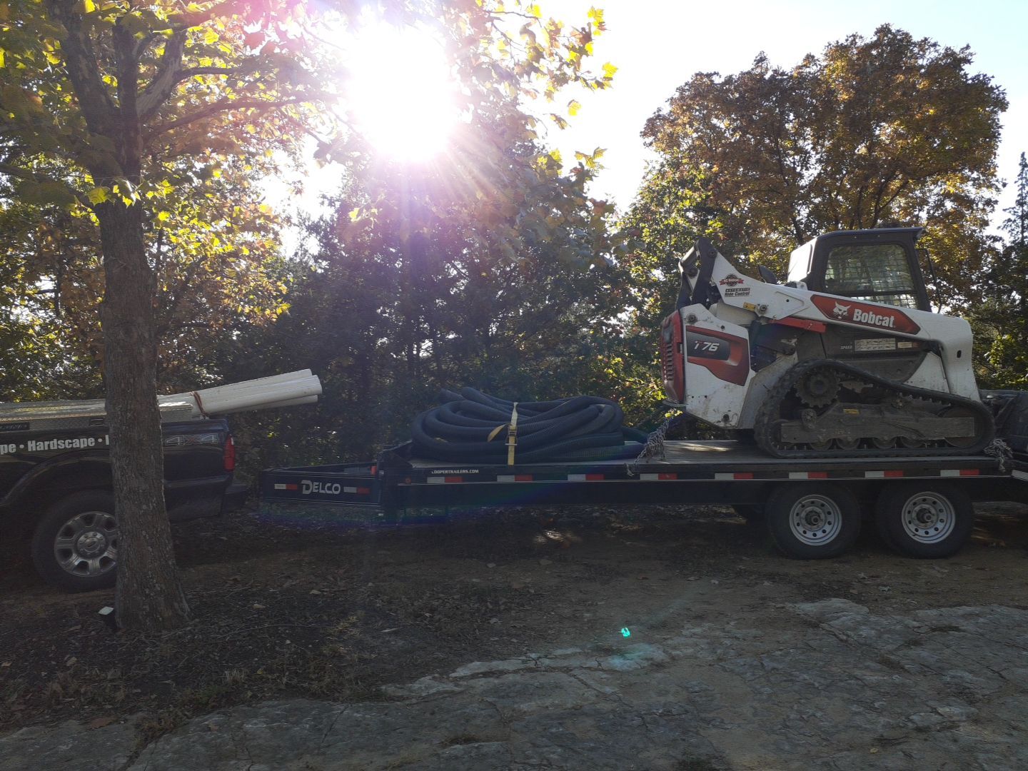 Supporting back of home with backfill at edge of steep creek by LAND ESCAPES LLC