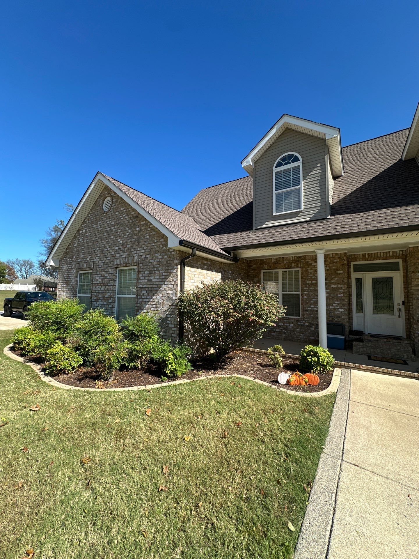 Roof and Gutter System Replacement with Stone Chimney Rebuild by Undersun Roofing 