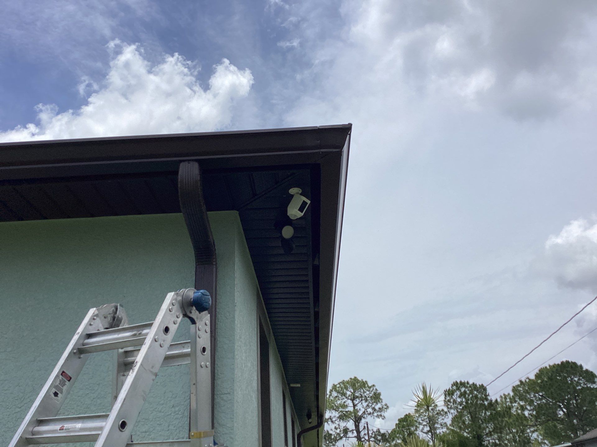 Musket Brown and New Downspouts in Lehigh Acres, FL  by Gutter Professors