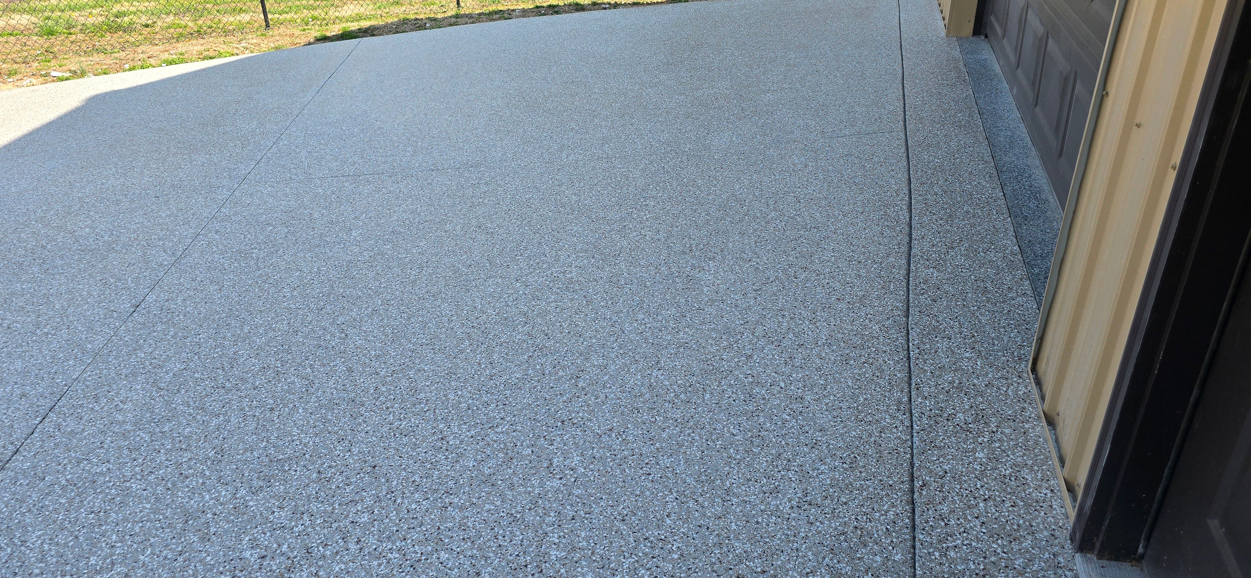 Driveway using Creekbed by Elite Floor Solutions
