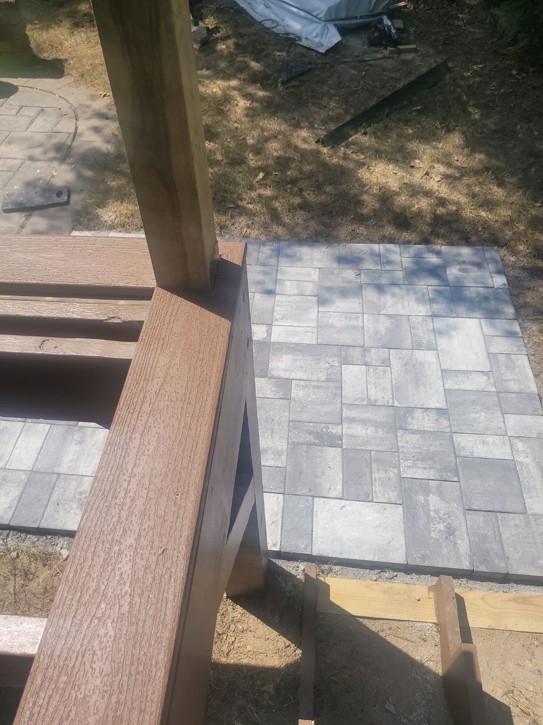 Fuquay-Varina Outdoor Upgrade – Composite Deck & Paved Landing by Elite Remodeling and Design LLC