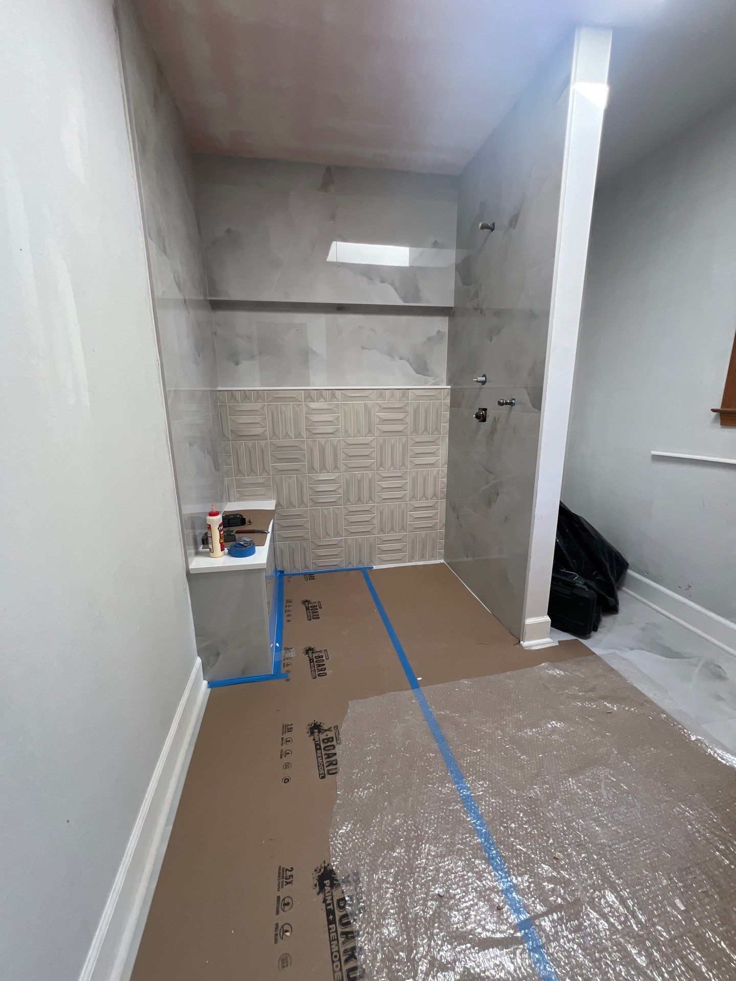 Modern Bathroom Remodeling Featuring Marble Tiles and Custom Cabinetry in Smyrna by Swift Home Renovations