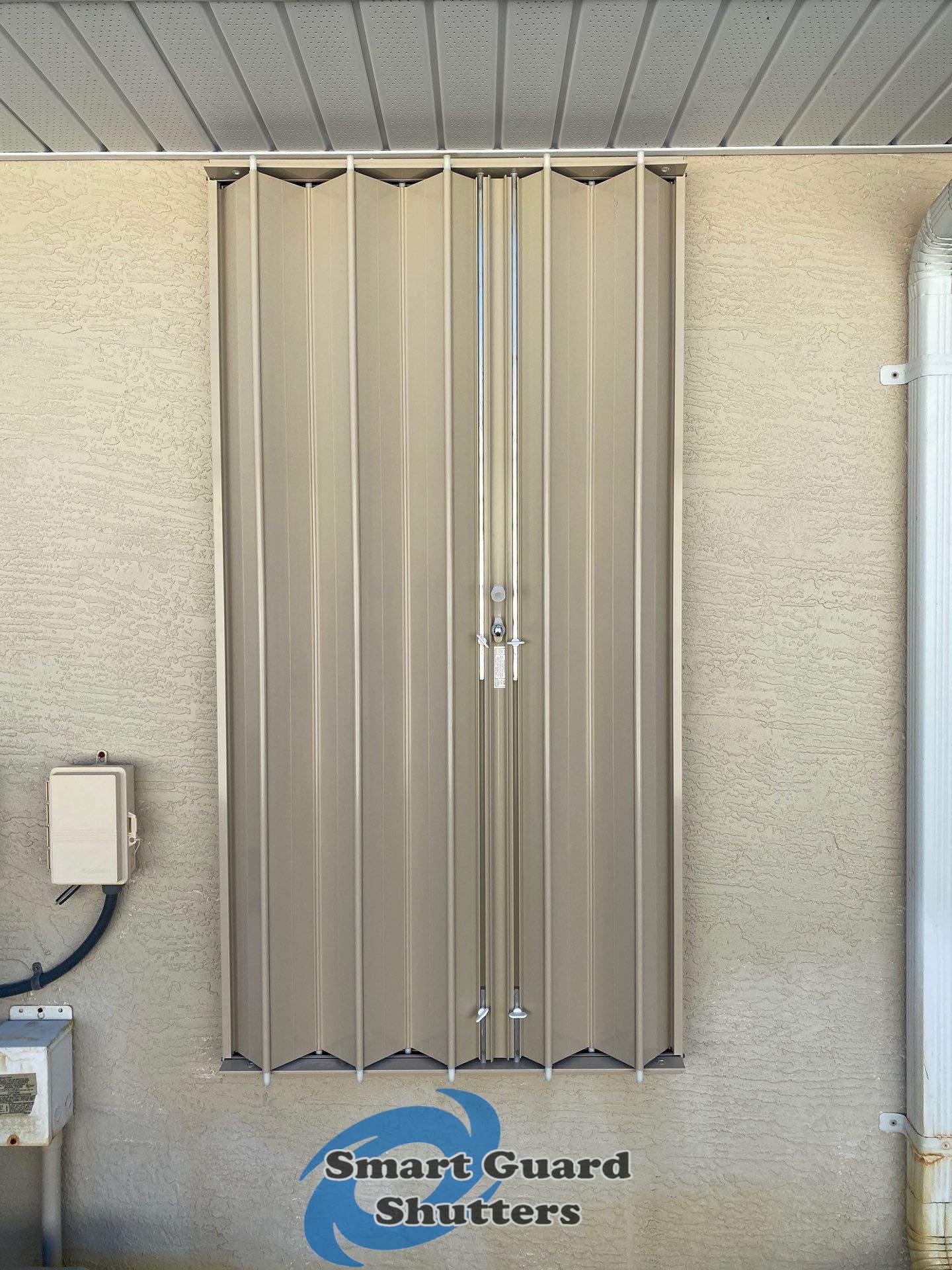 Accordion Shutters in Beige by Smart Guard Shutters