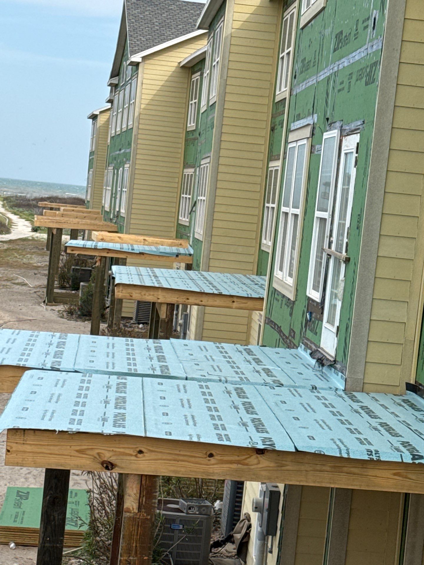 Walk Out Patio Cover by Bayfront Roofing and Construction