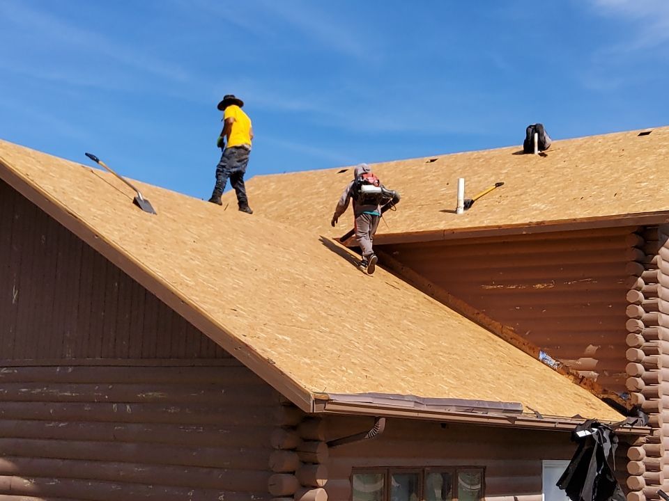 Hill Country Guest Ranch using Steel Roofing, Gutters, Log Cabin Staining by Lightning Exteriors