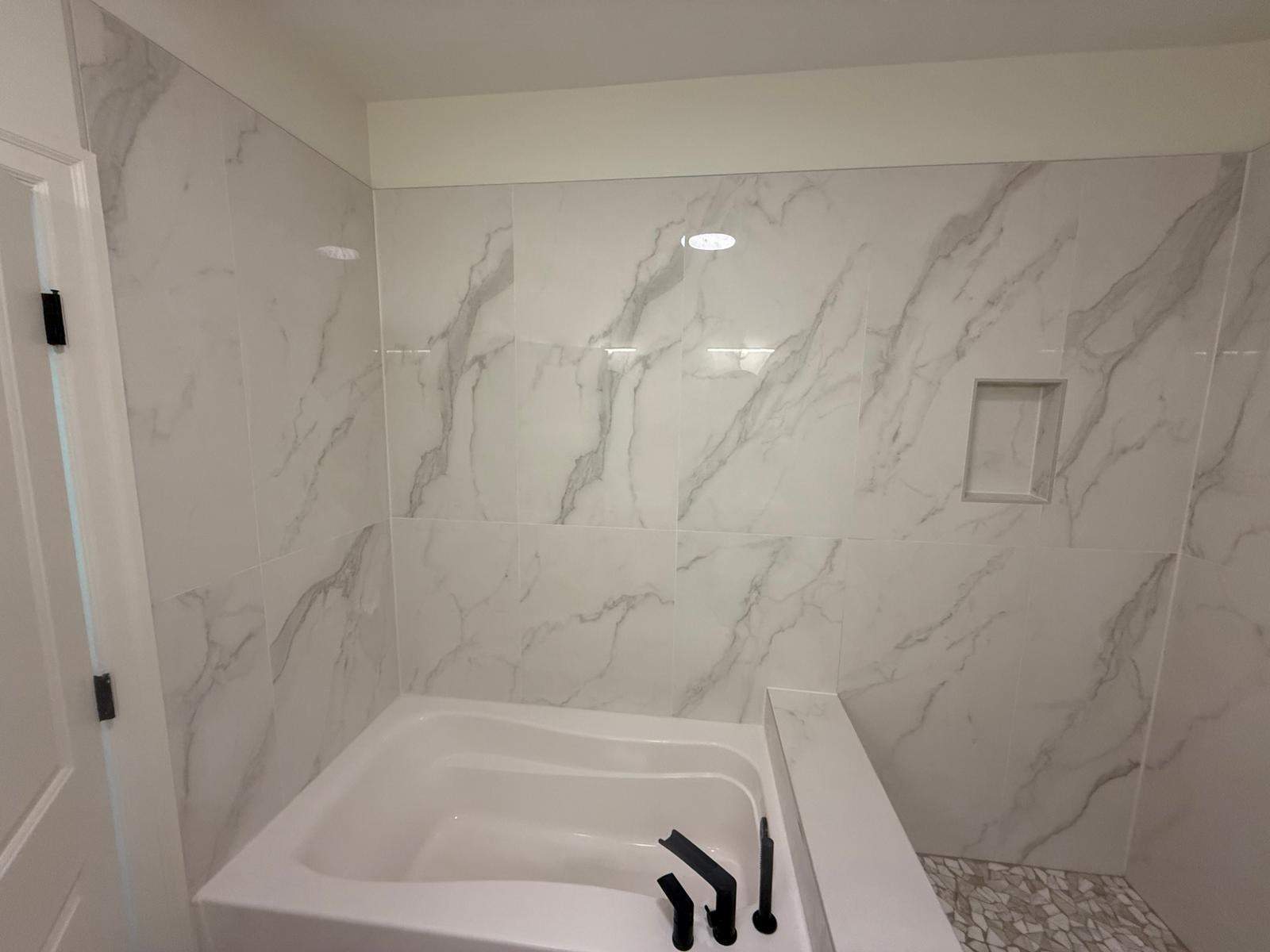 Shower and tub tiling  by Prudencio