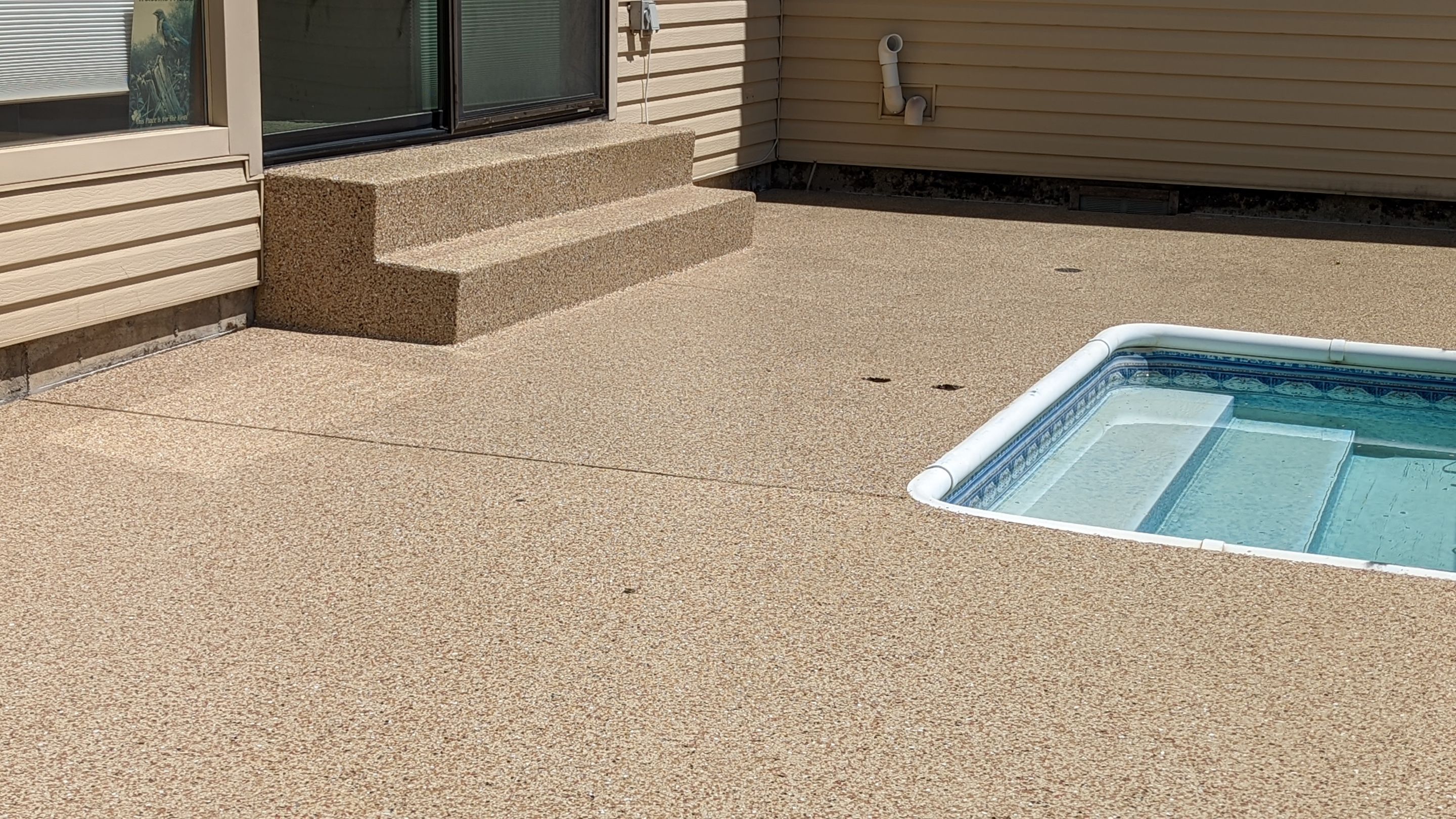 Garage Transformation using Domino for Garage and Pecan for Pool Deck by Croc Coatings, LLC