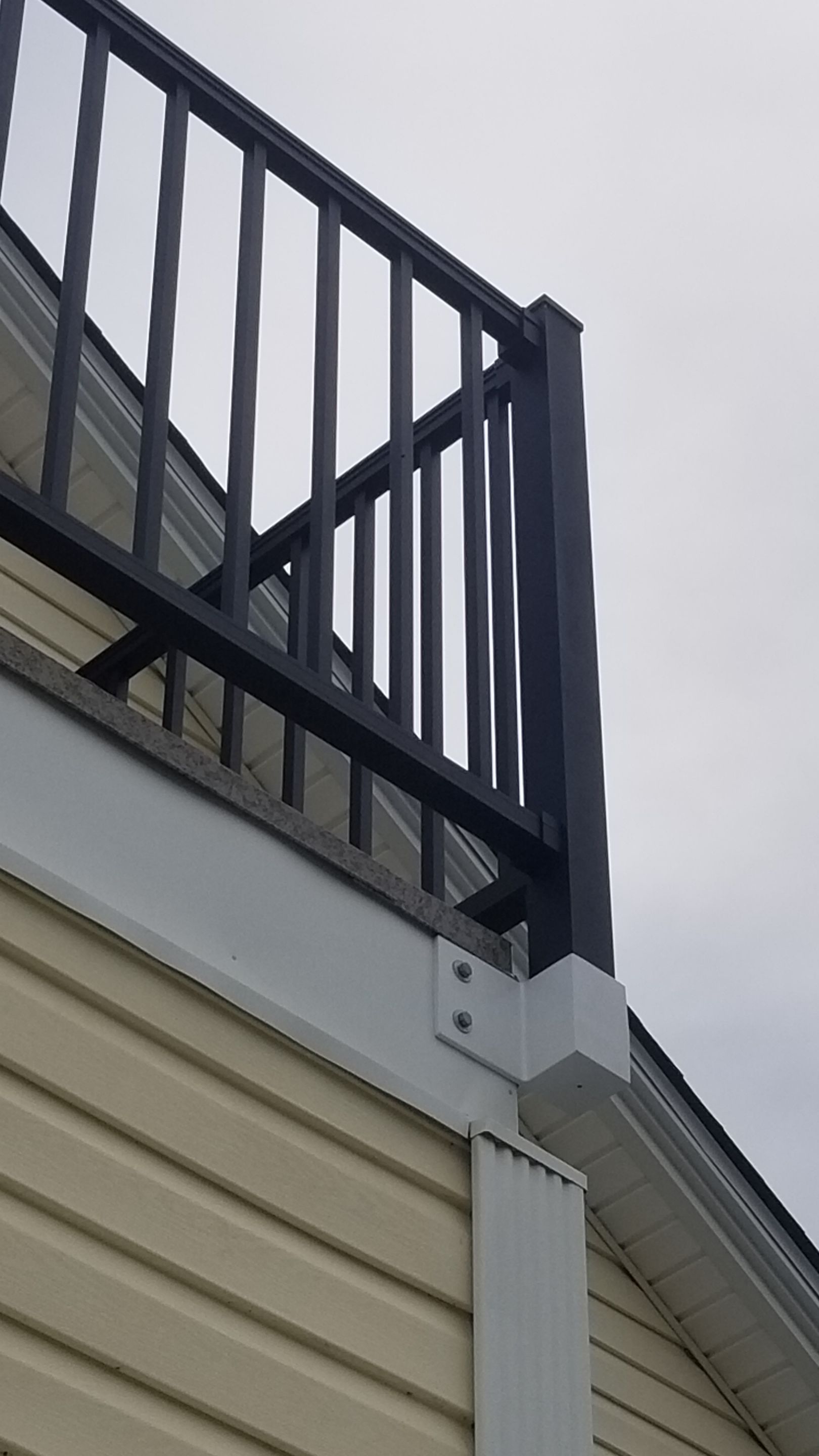Rebuild balcony flat roofing TREX decking stairway and Railings in Wyandotte, MI by Northwest Construction 