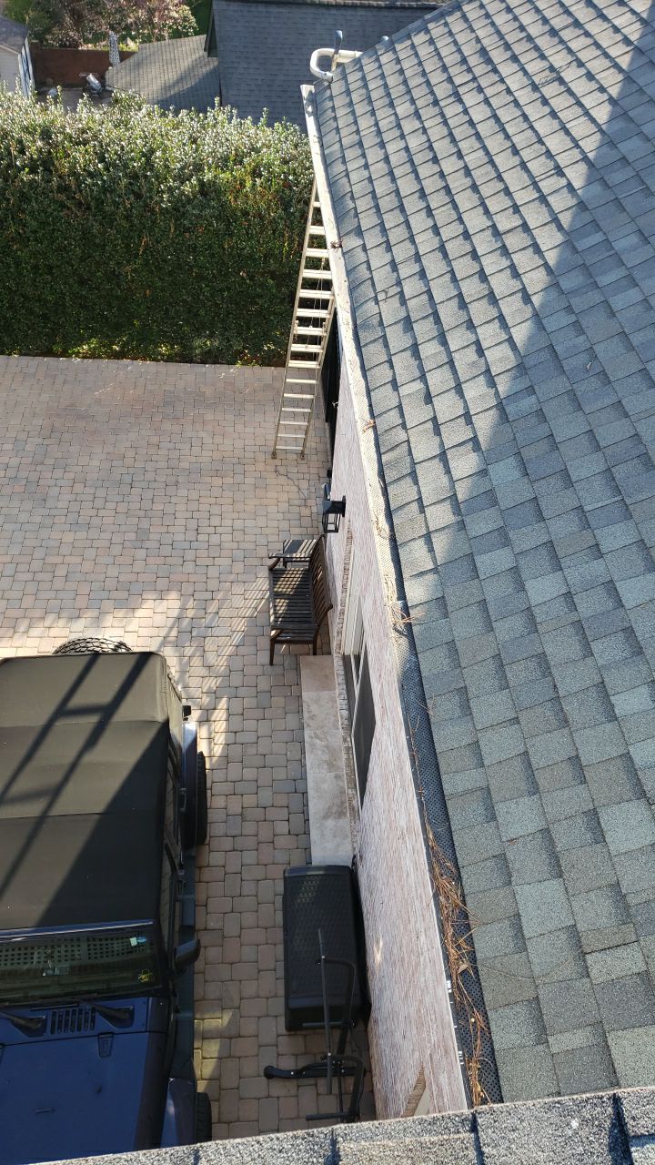 Gutter Cleaning using water by Power Wash Masters LLC