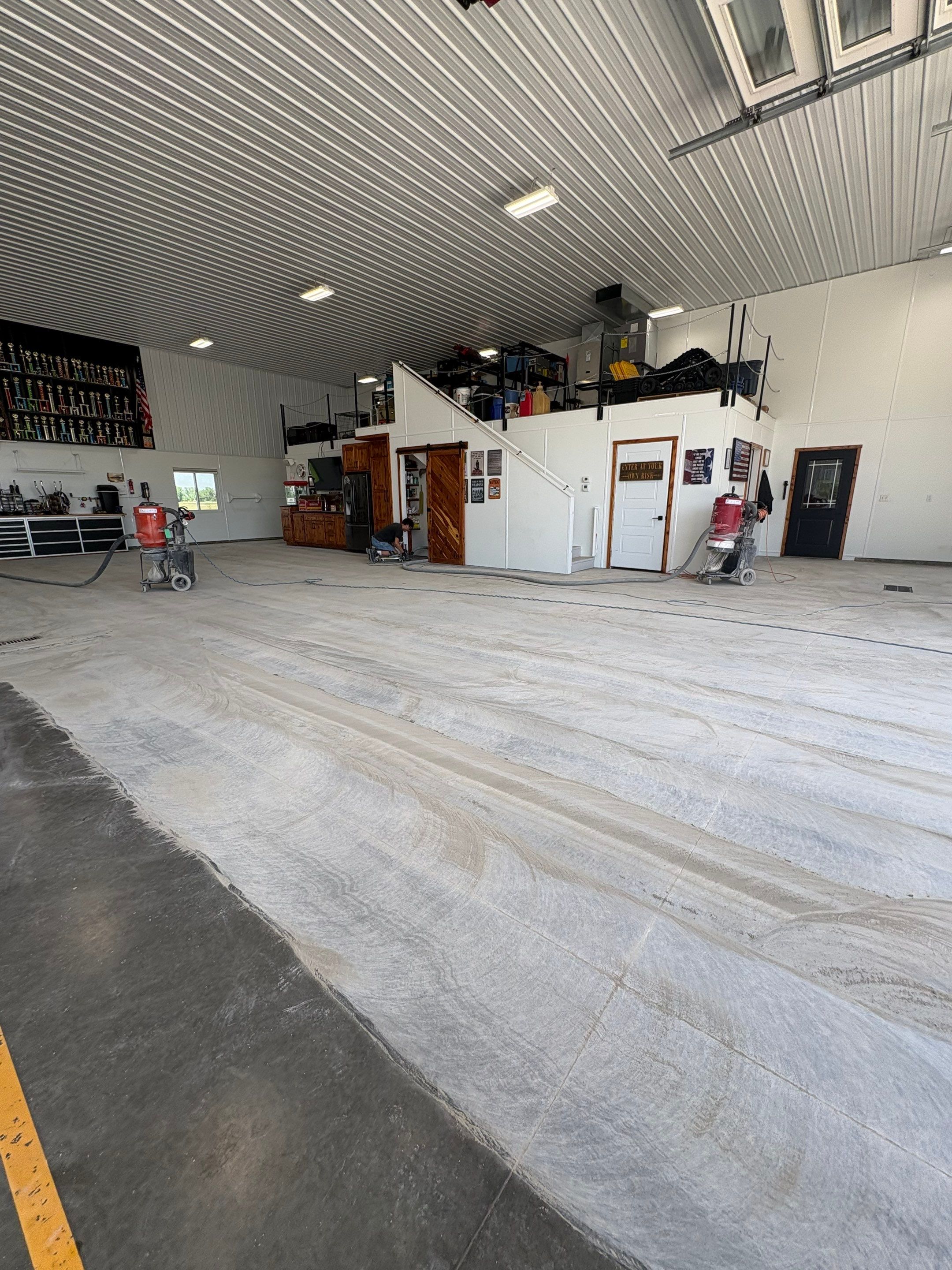 Multi-Stage Concrete Floor Coating for Egan Shop and RV Storage by Select Painting, Coatings & Garage Cabinets