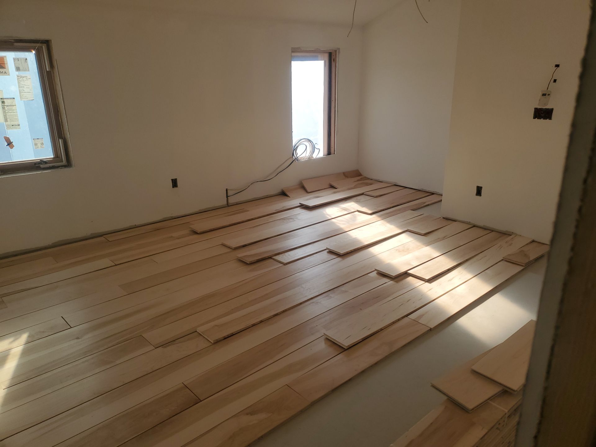 Full glue down Installation over radiant heat 7" Maple character grade by Ann Arbor Hardwoods 