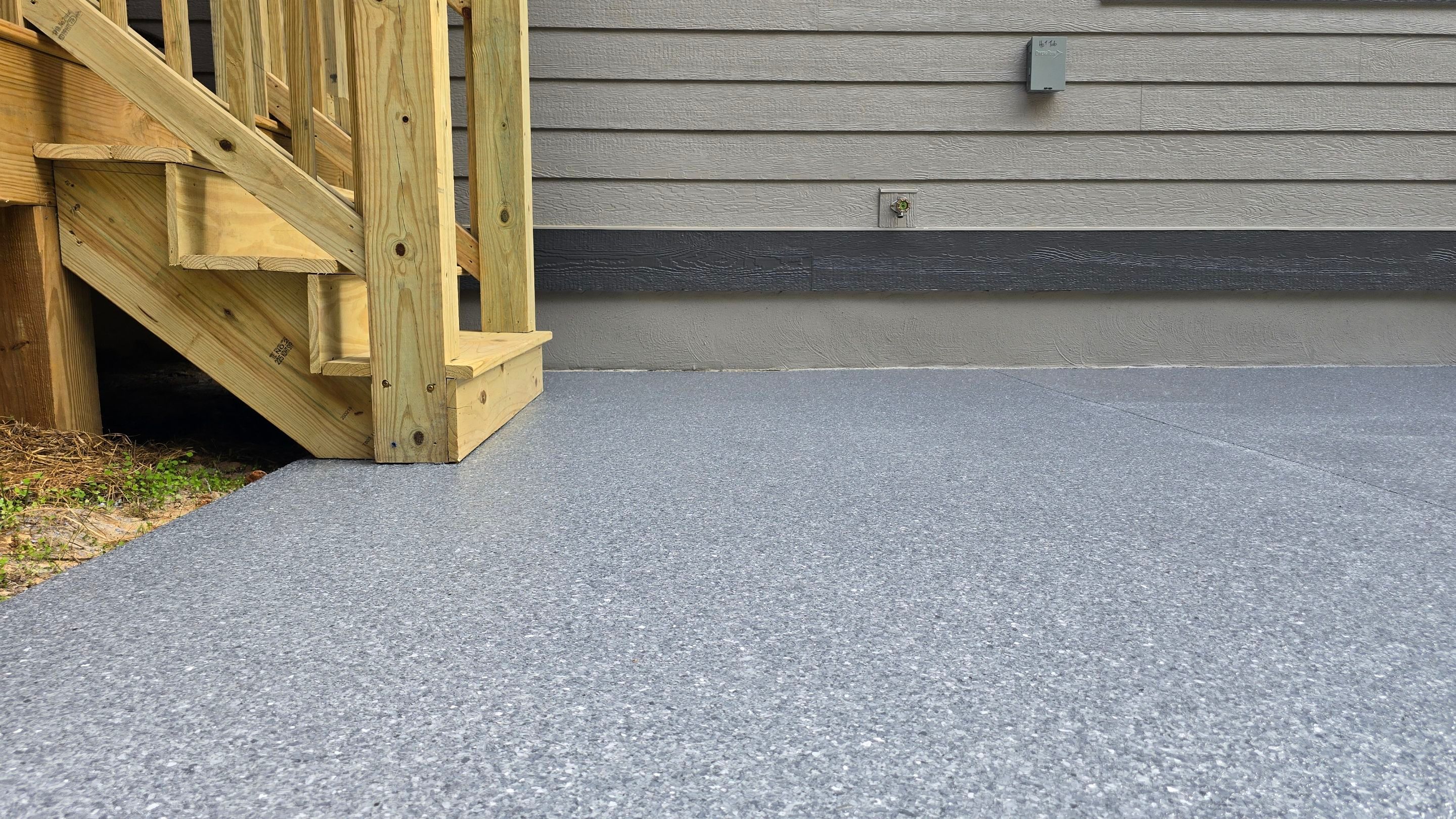 Patio Using Basalt & Garage Using Gravel by Elite Floor Solutions