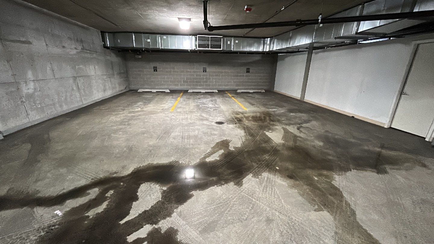 Parking garage using Hot water by Northern Power Washing LLC.