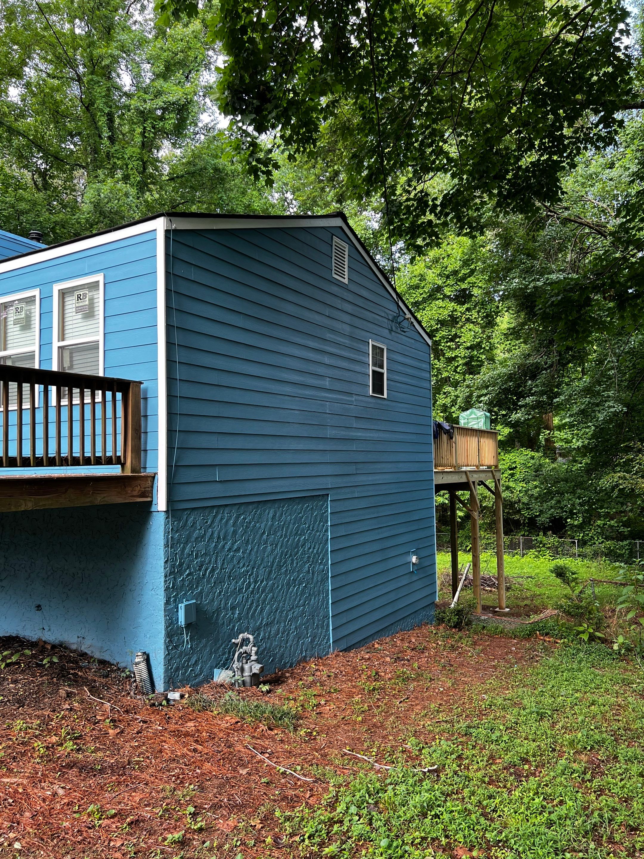 Elevated Wood Deck and Blue Lap Siding Installation in Kennesaw by Swift Home Renovations