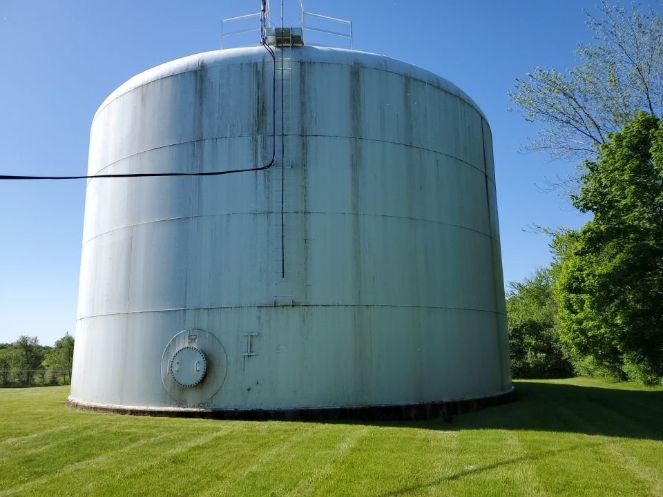 Water tank cleaning by Northern Power Washing LLC.