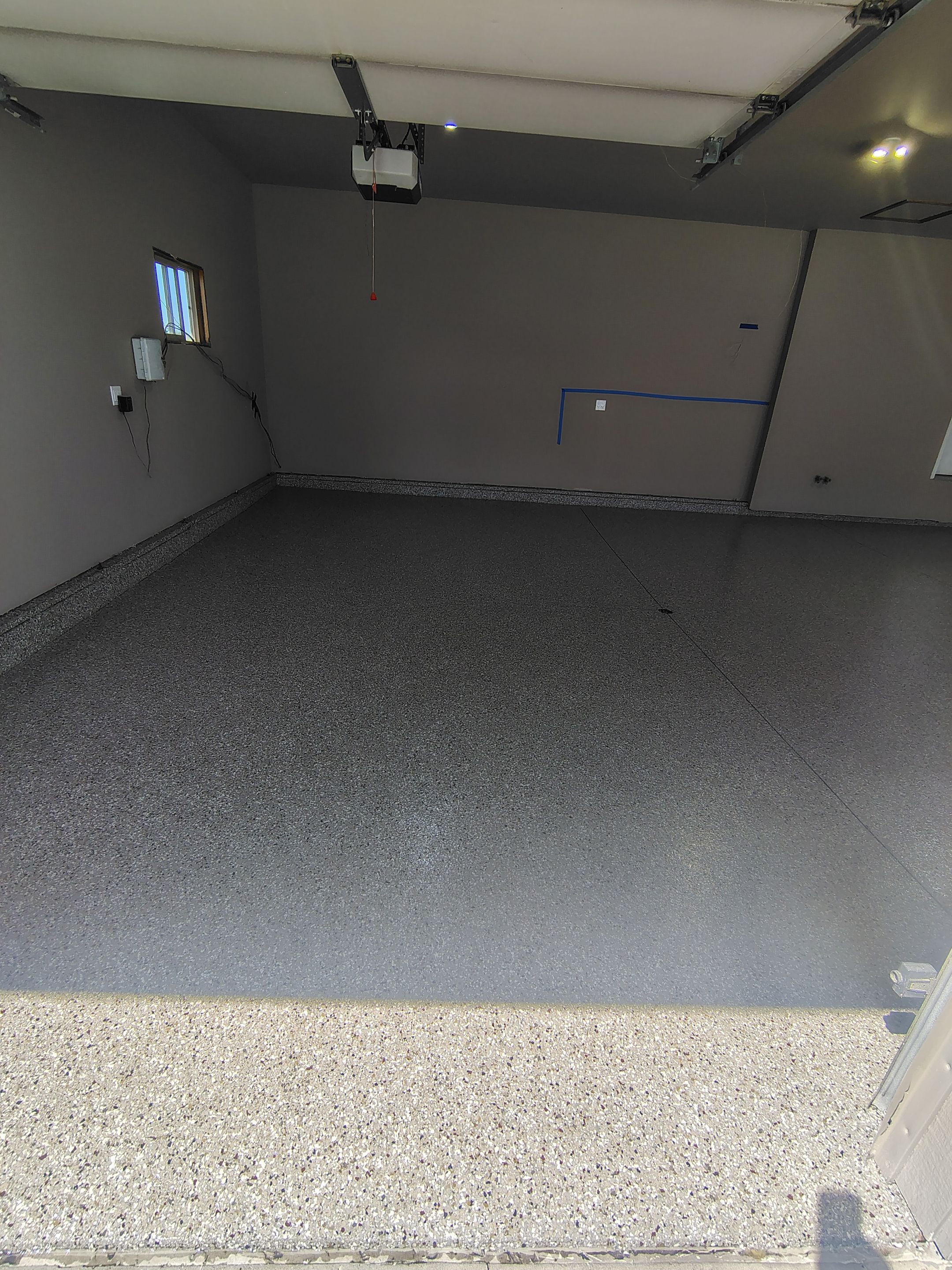 Sioux Falls Garage Concrete Repair and Epoxy Flake Floor Coating by Select Painting, Coatings & Garage Cabinets