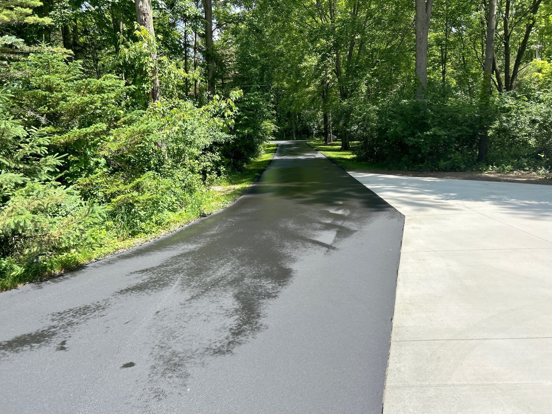 High end residential driveway by Quality Asphalt & Maintenance LLC