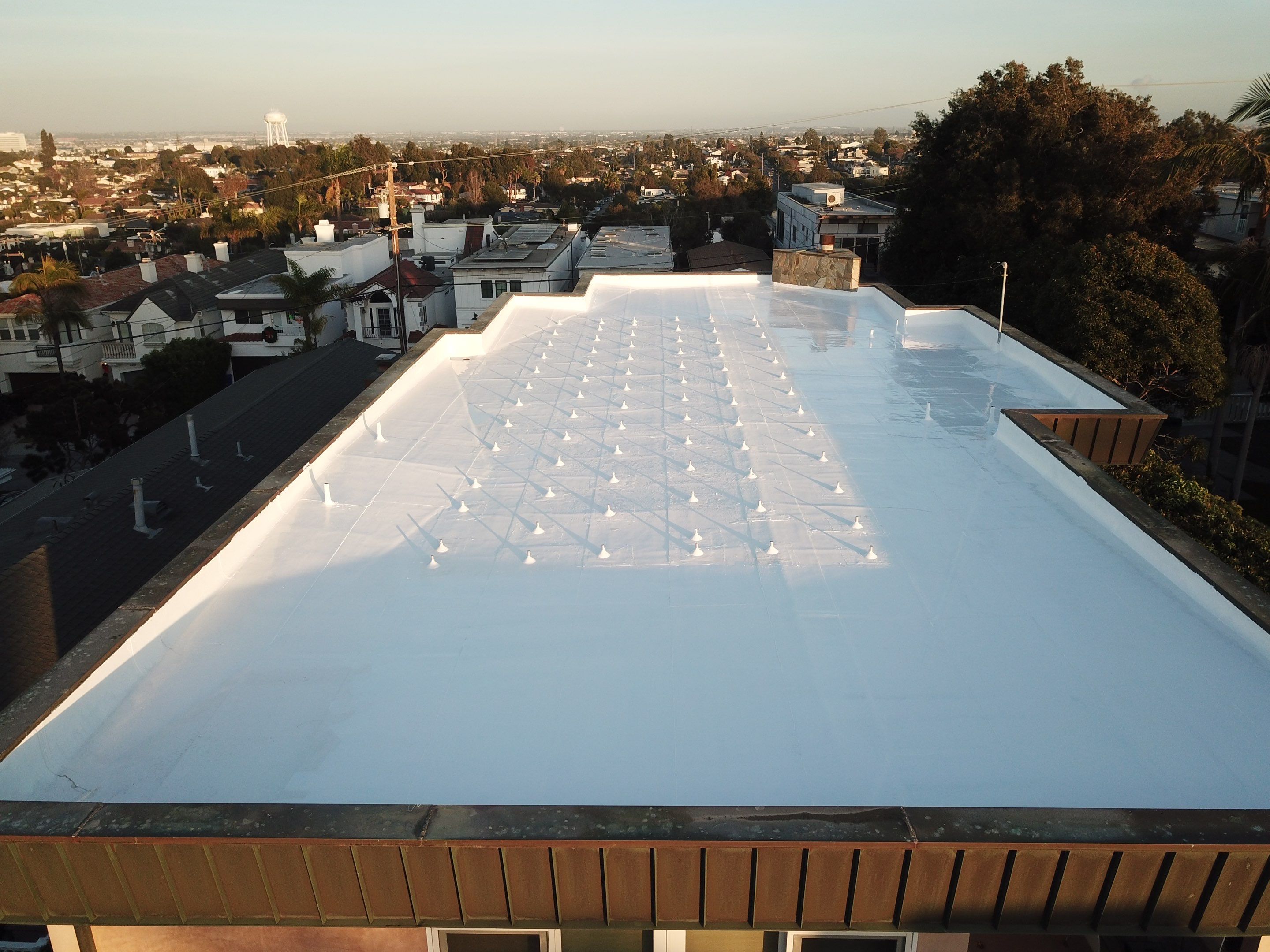 Residential Roofing Installation using ASC Silicone Membrane by Hull Brothers Roofing