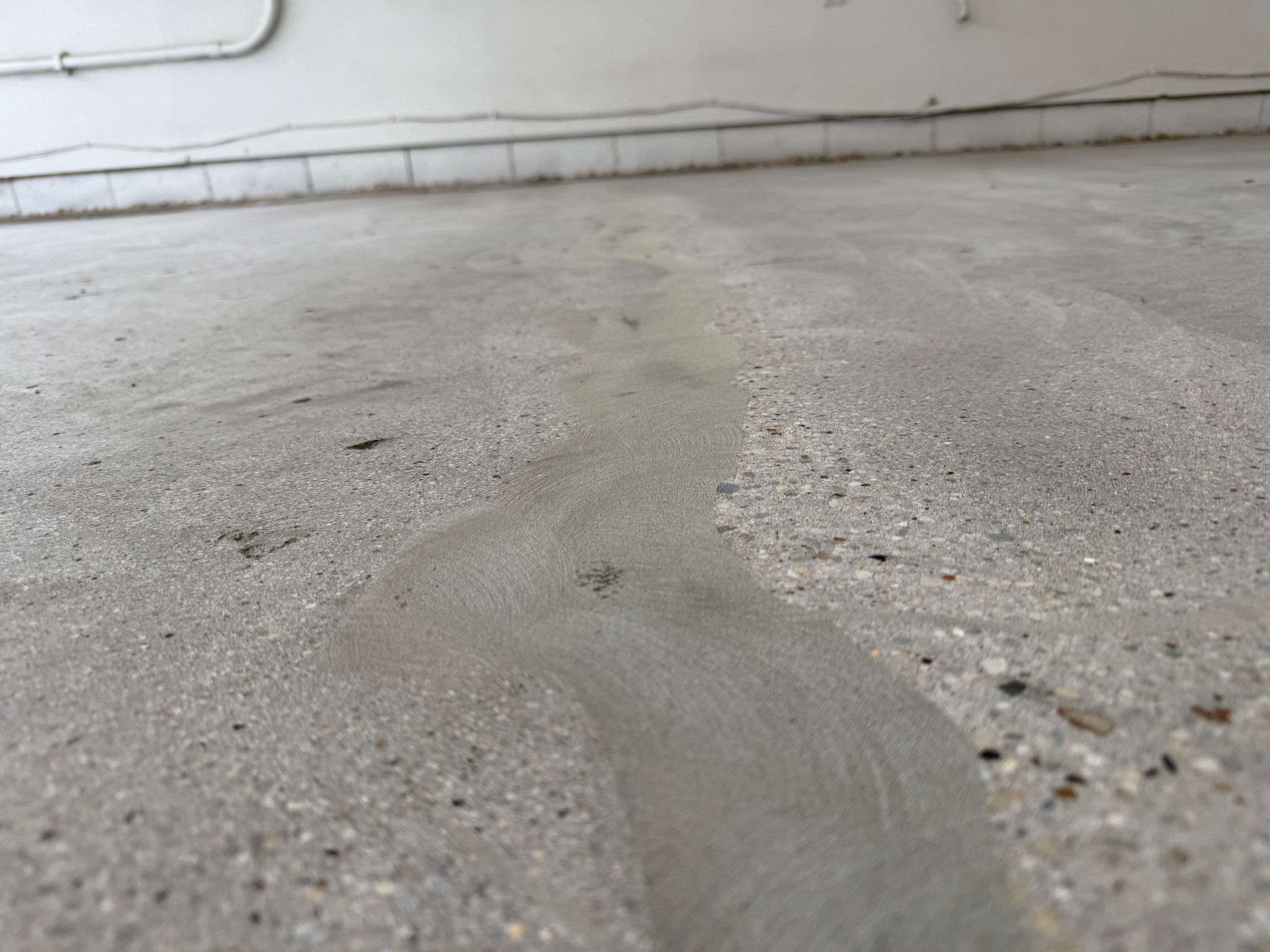 Feather Grey Garage Floor Coating and Crack Repair in Beresford by Select Painting, Coatings & Garage Cabinets