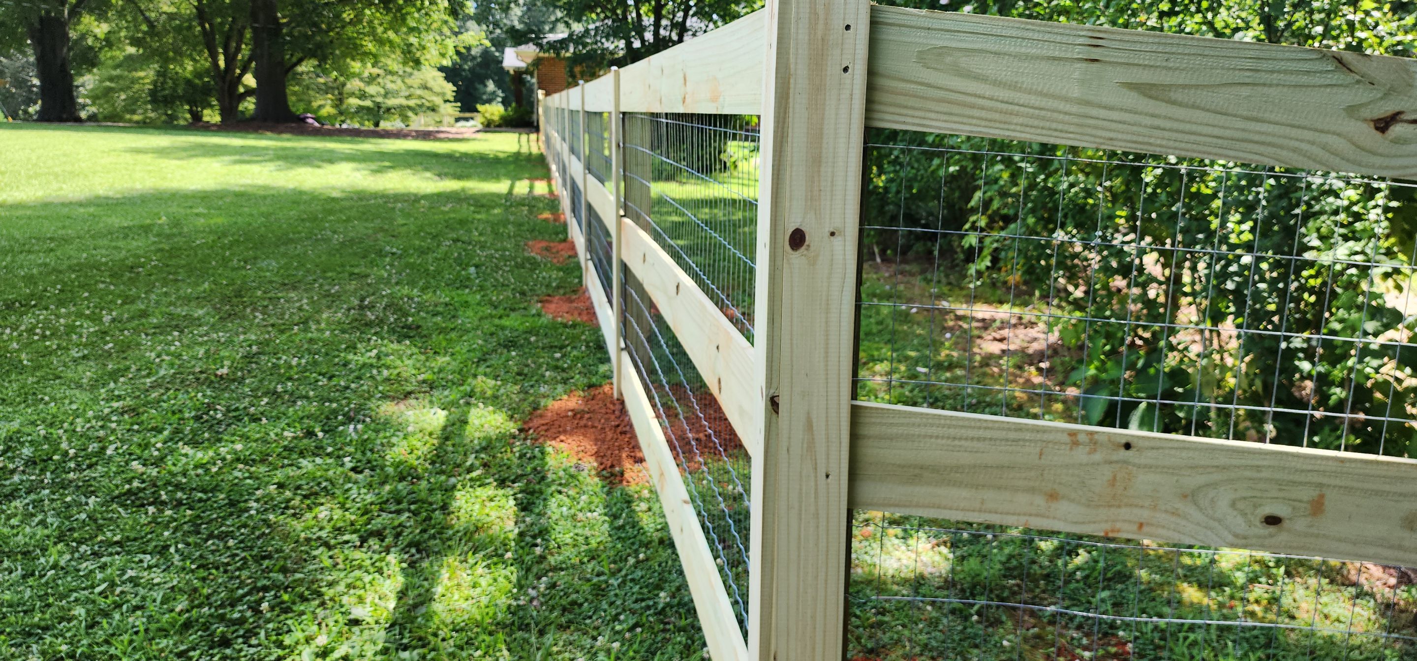 Fence Installation of 3 Rail Ranch with Wire Backing by Titans of Timber Fence & Stain